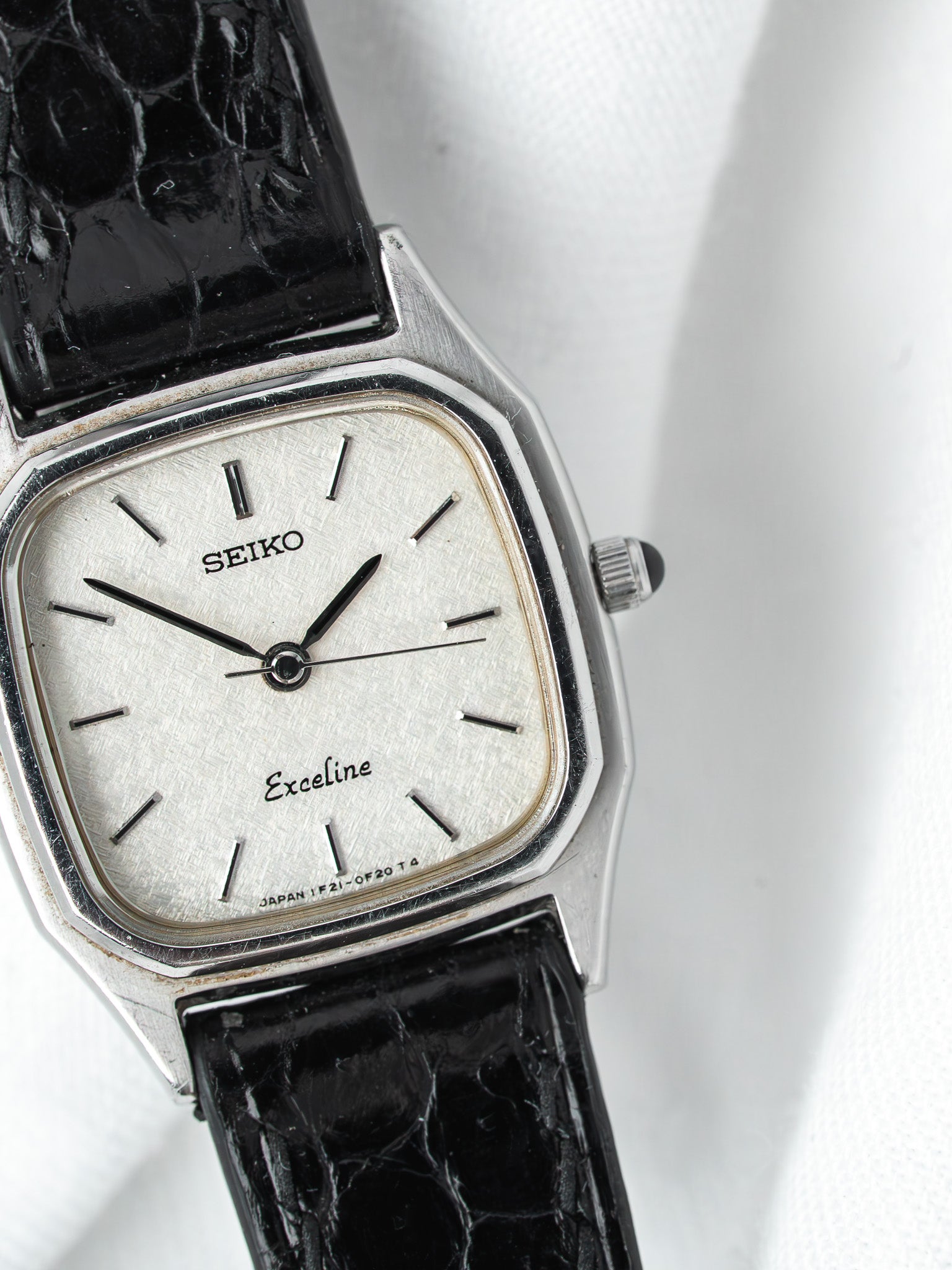 Seiko Exceline vintage watch with silver dial, black alligator strap, and steel case