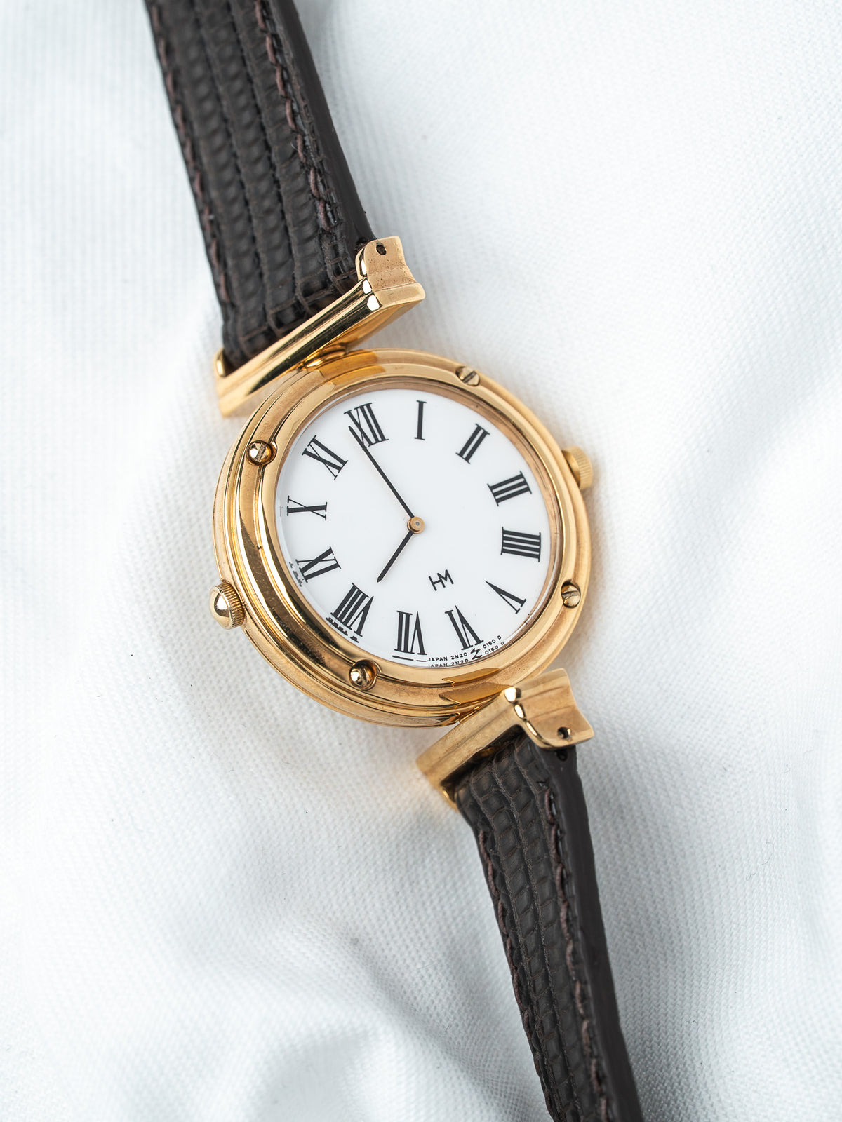 Hamilton vintage watch with gold case, white dial Roman numerals, brown leather strap
