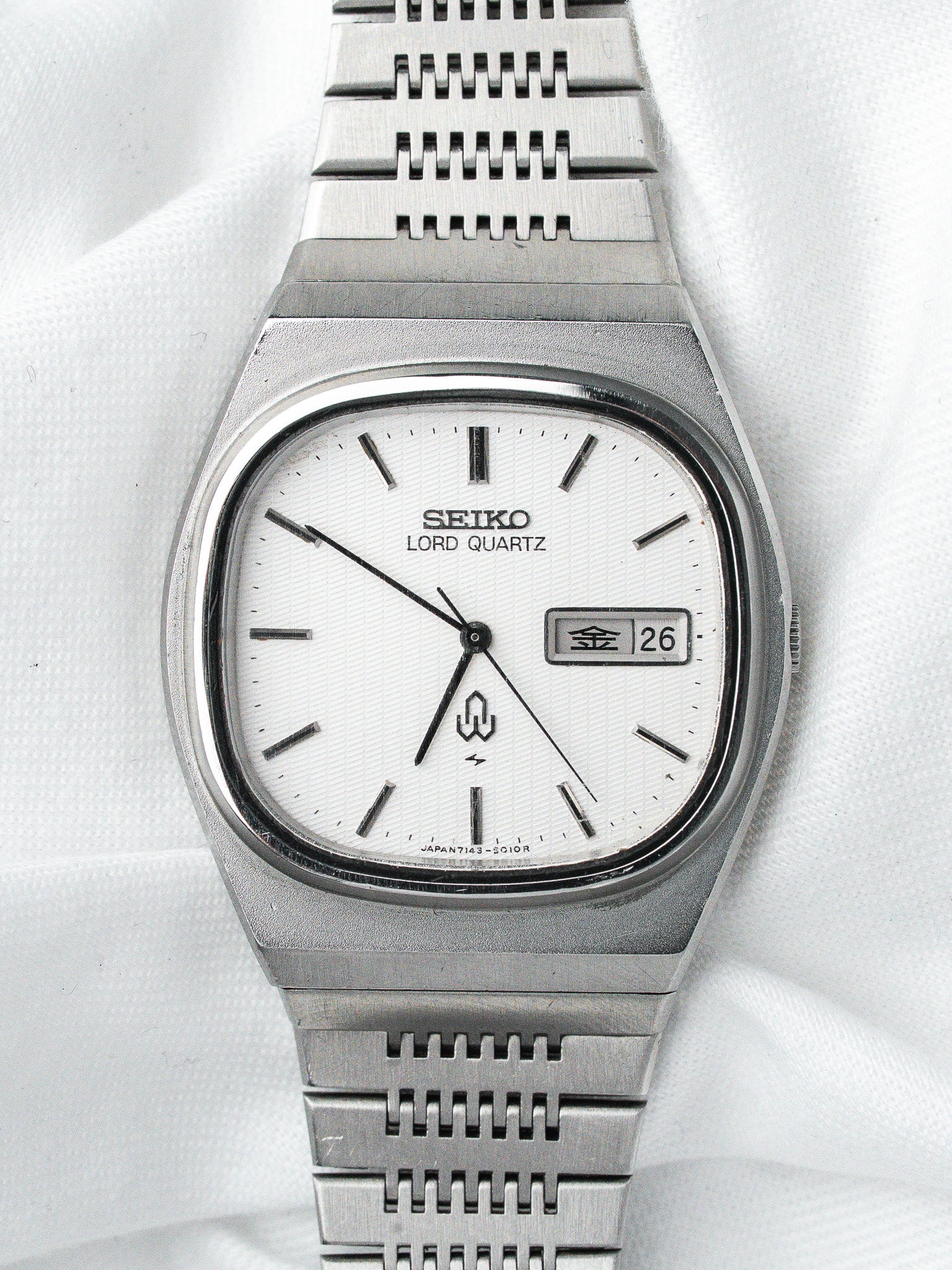 Seiko Lord Quartz vintage watch with white dial, steel case and bracelet, day-date display