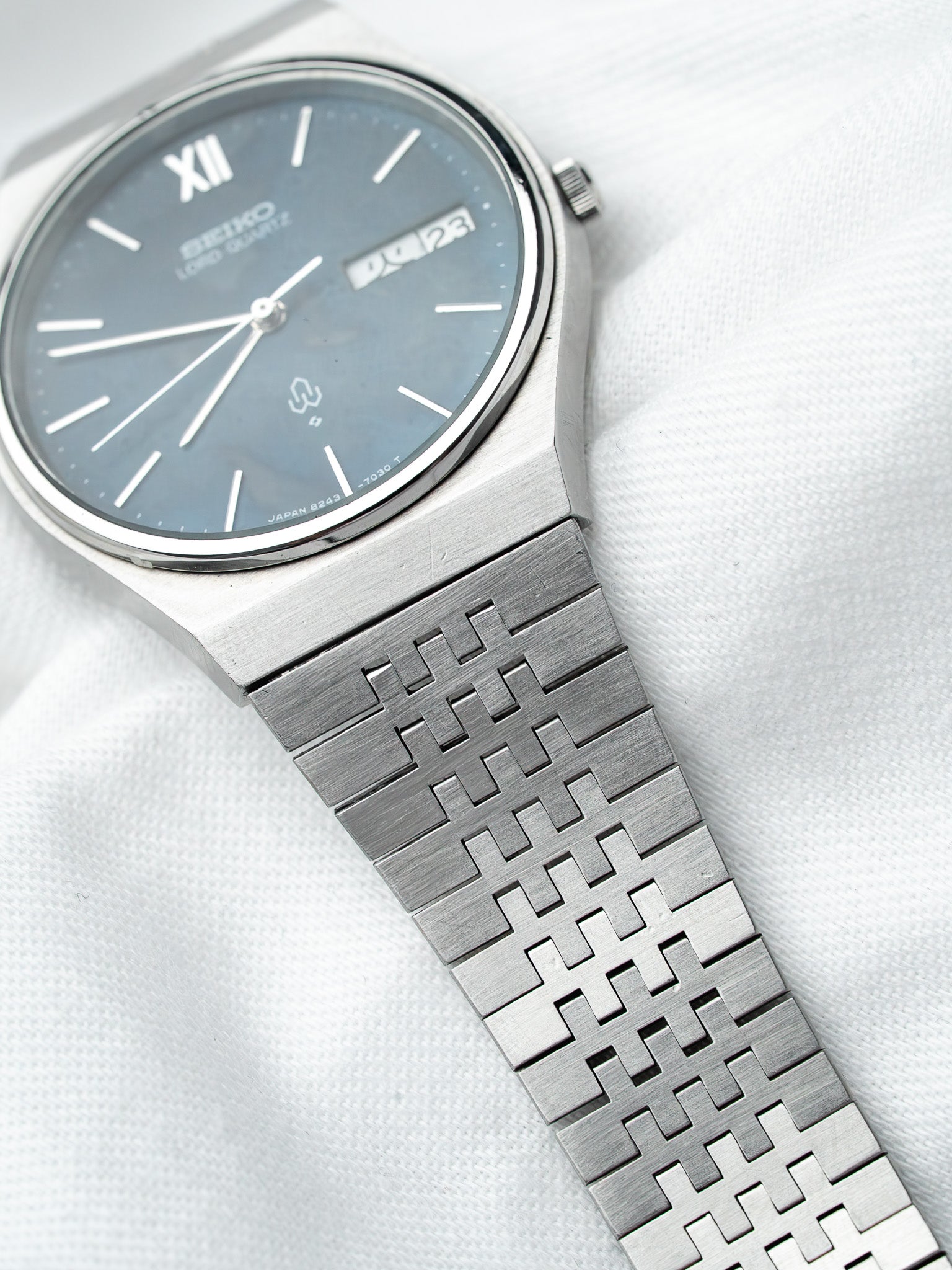 Seiko Lord Quartz vintage watch with blue dial and geometric steel bracelet