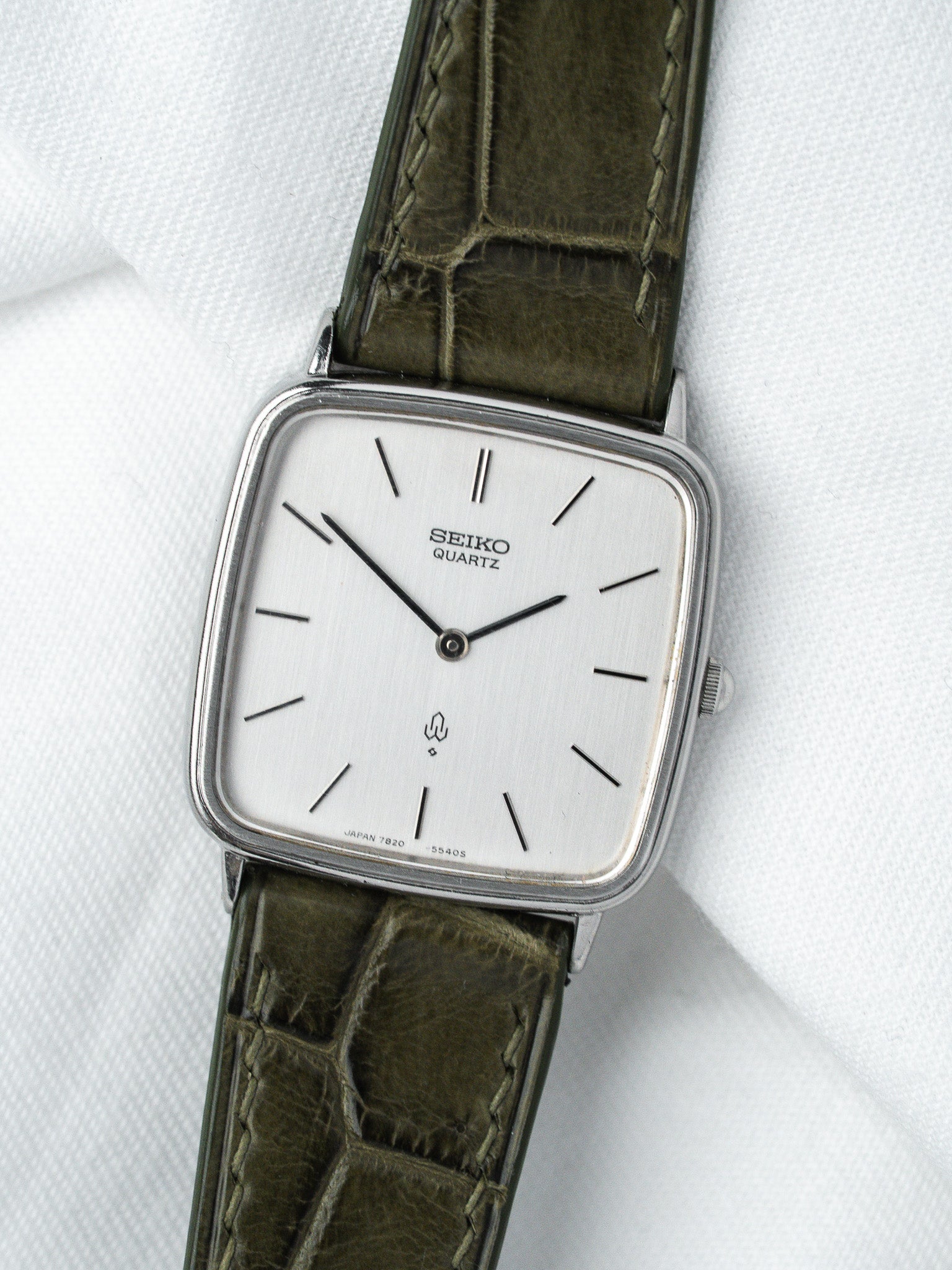 Seiko Quartz vintage watch with square case, white dial, olive green leather strap