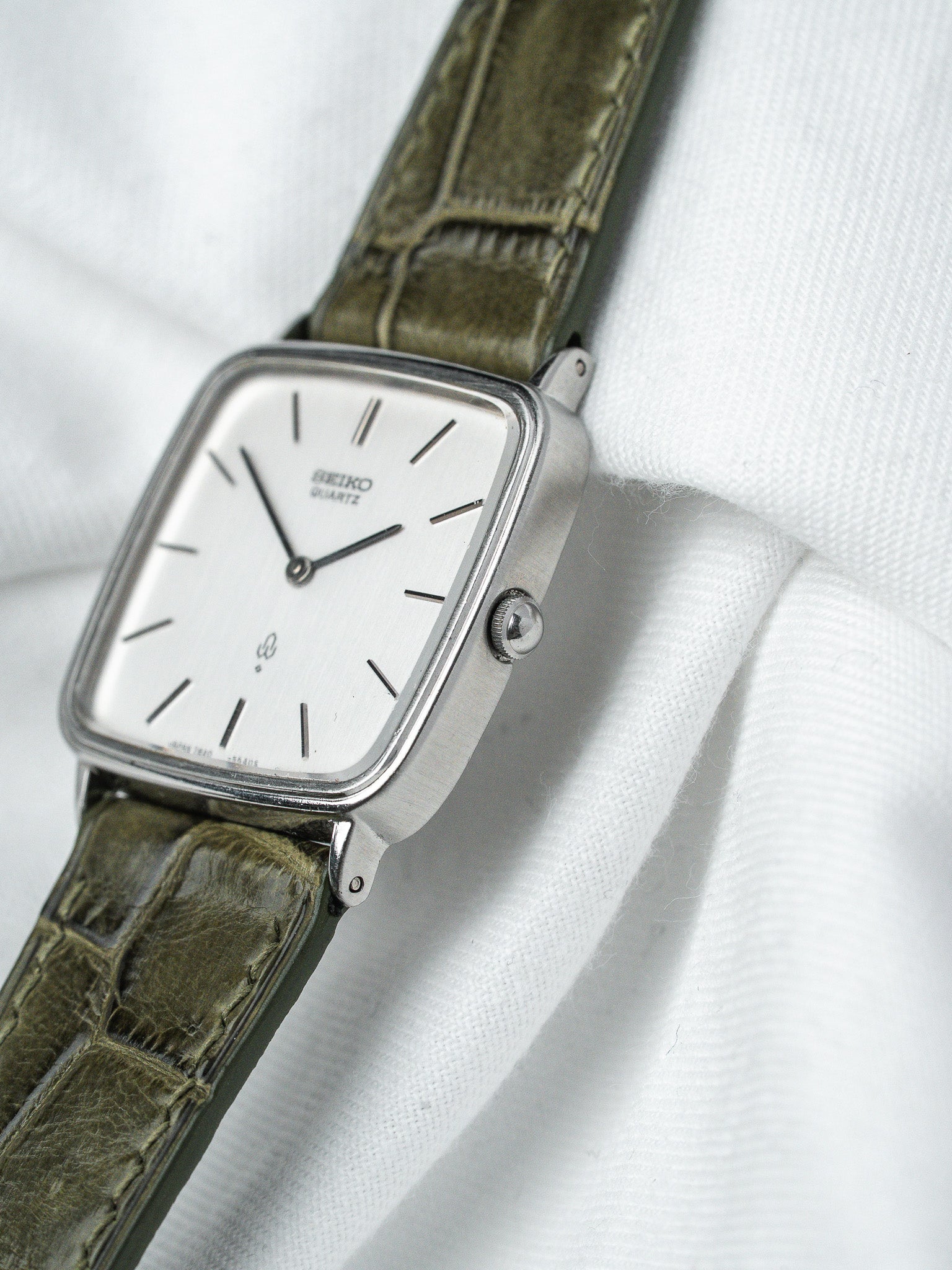 Seiko Quartz vintage watch with silver dial, olive green leather strap, square case