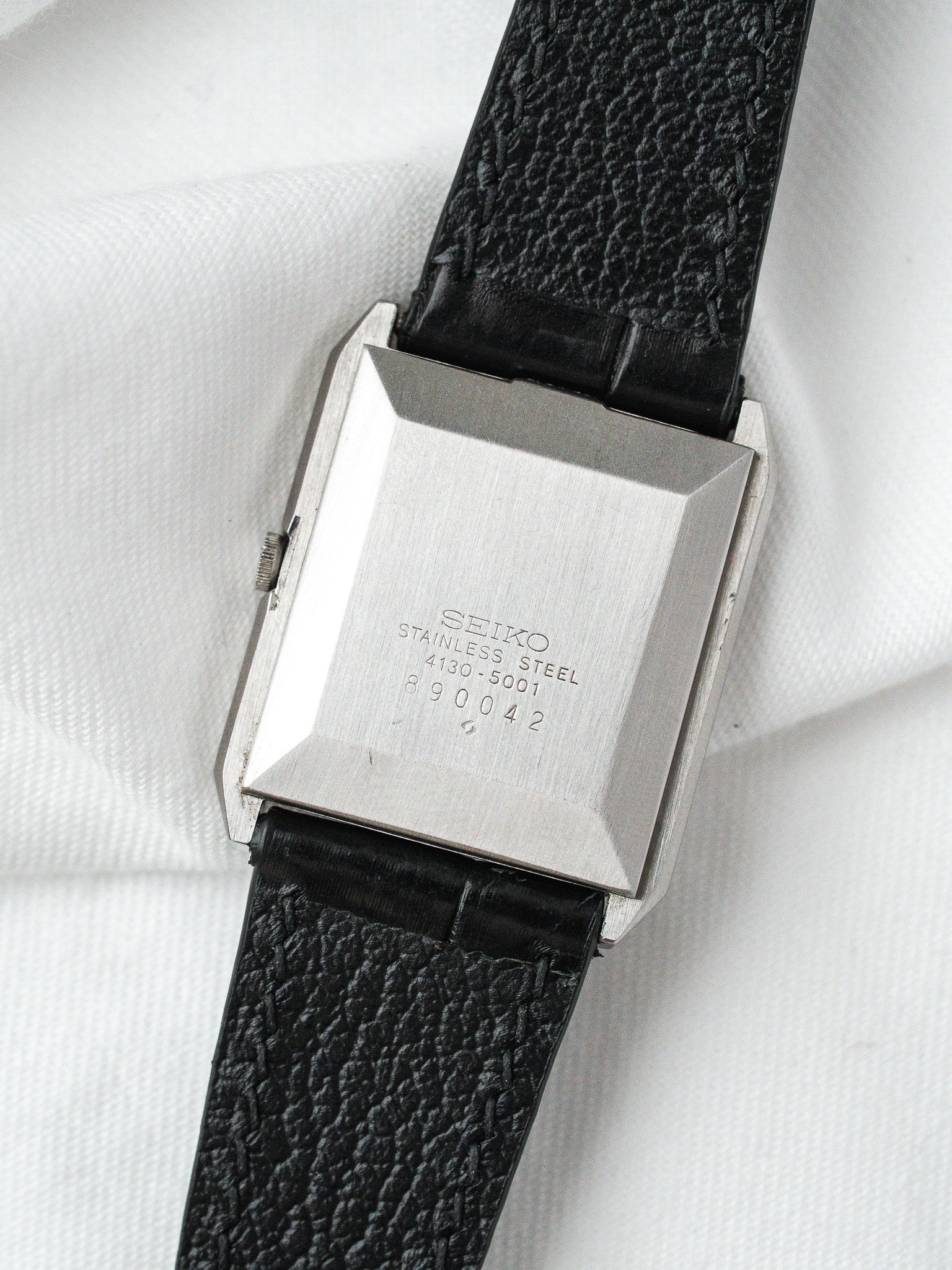 Seiko vintage watch with stainless steel case and black textured strap