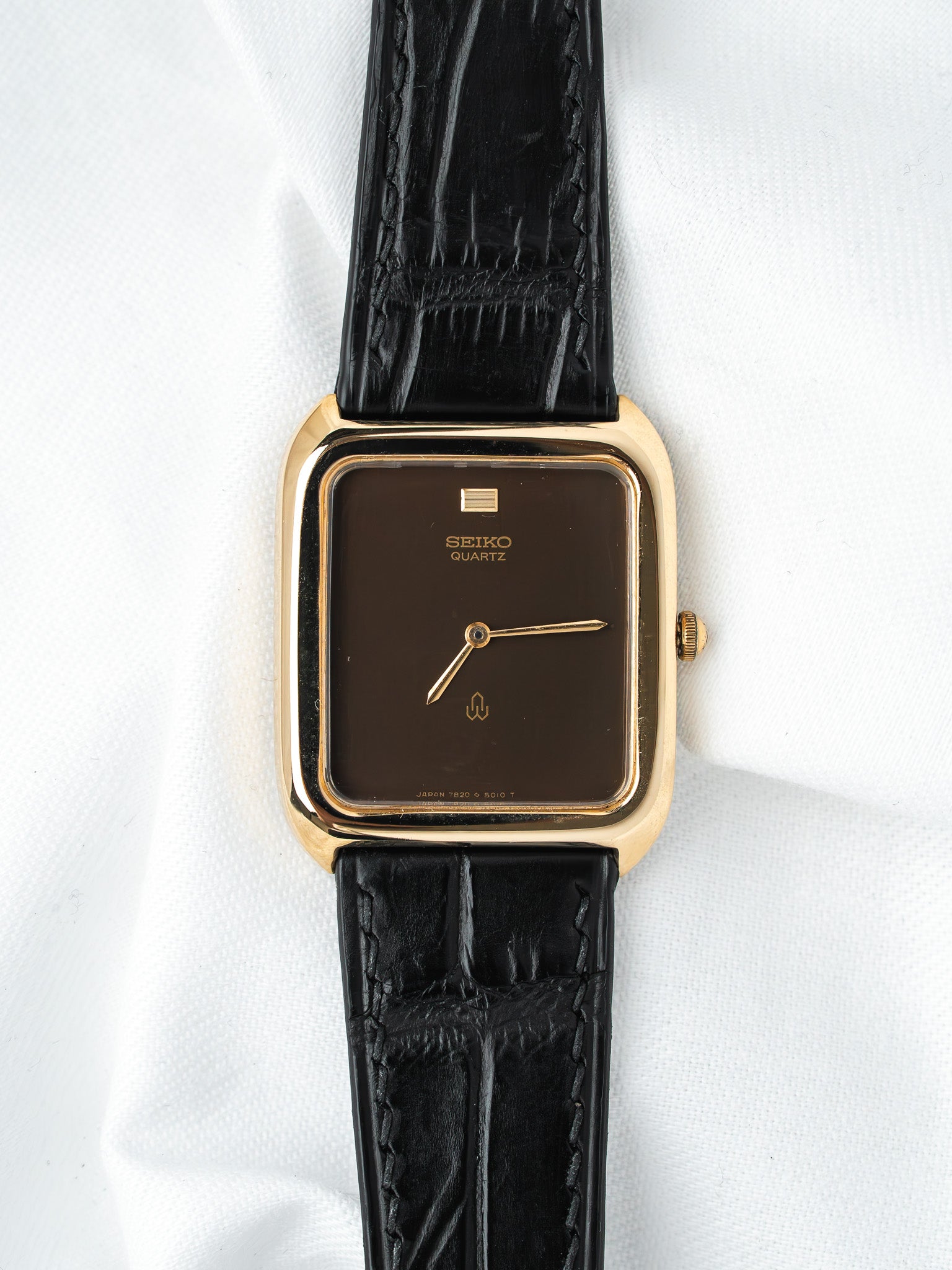 Seiko Quartz vintage watch with gold case, brown dial, black leather strap