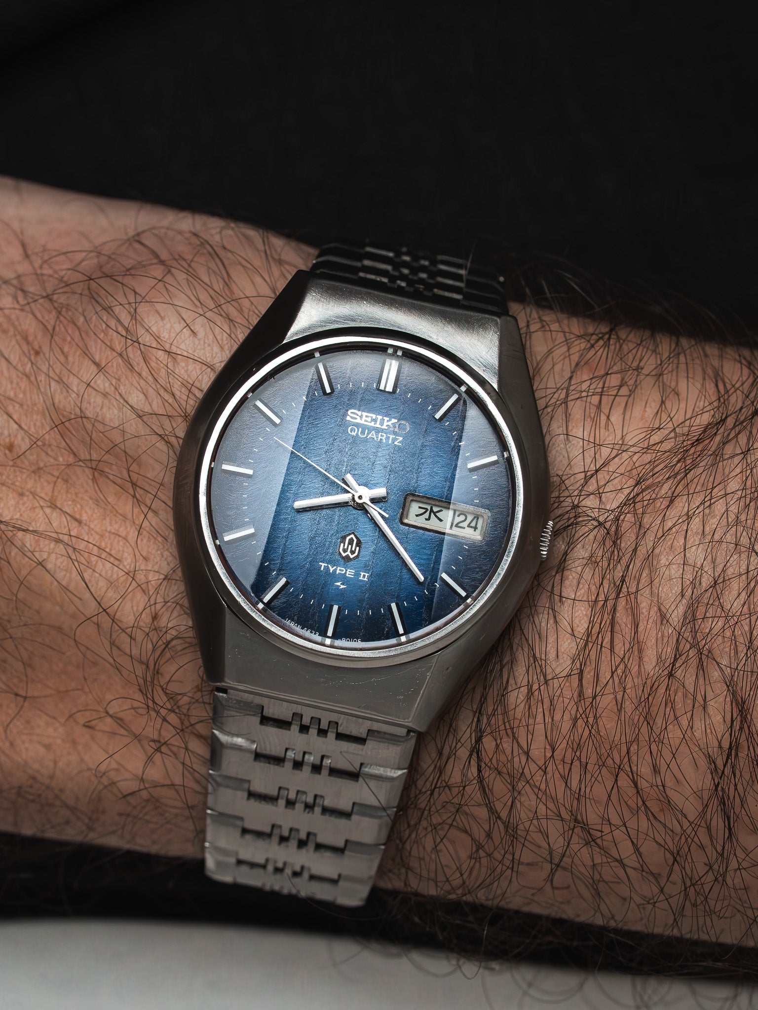 Seiko Quartz Type II vintage watch with blue dial and steel bracelet on wrist