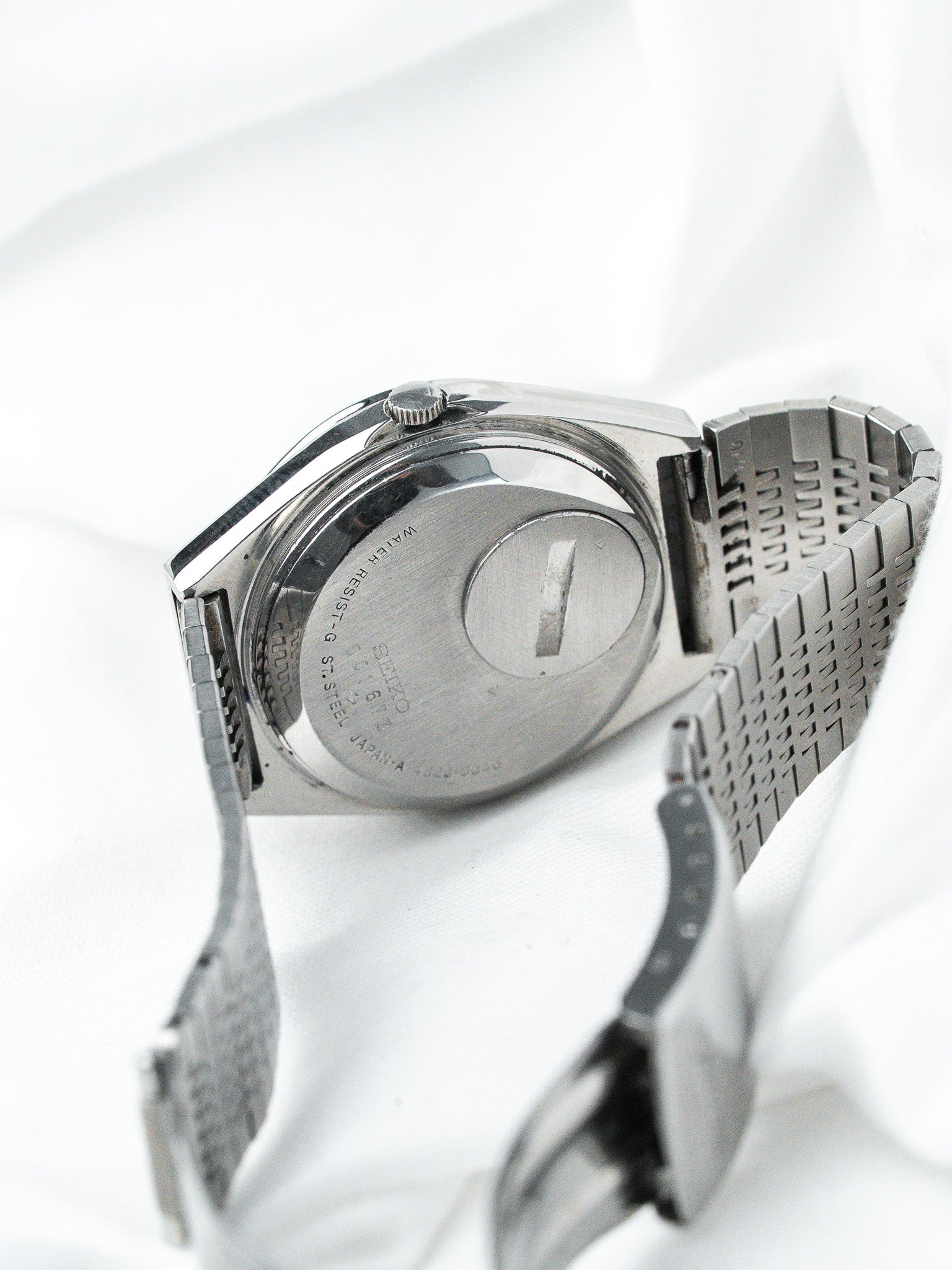 Seiko vintage watch back, stainless steel case and bracelet, engraved details visible