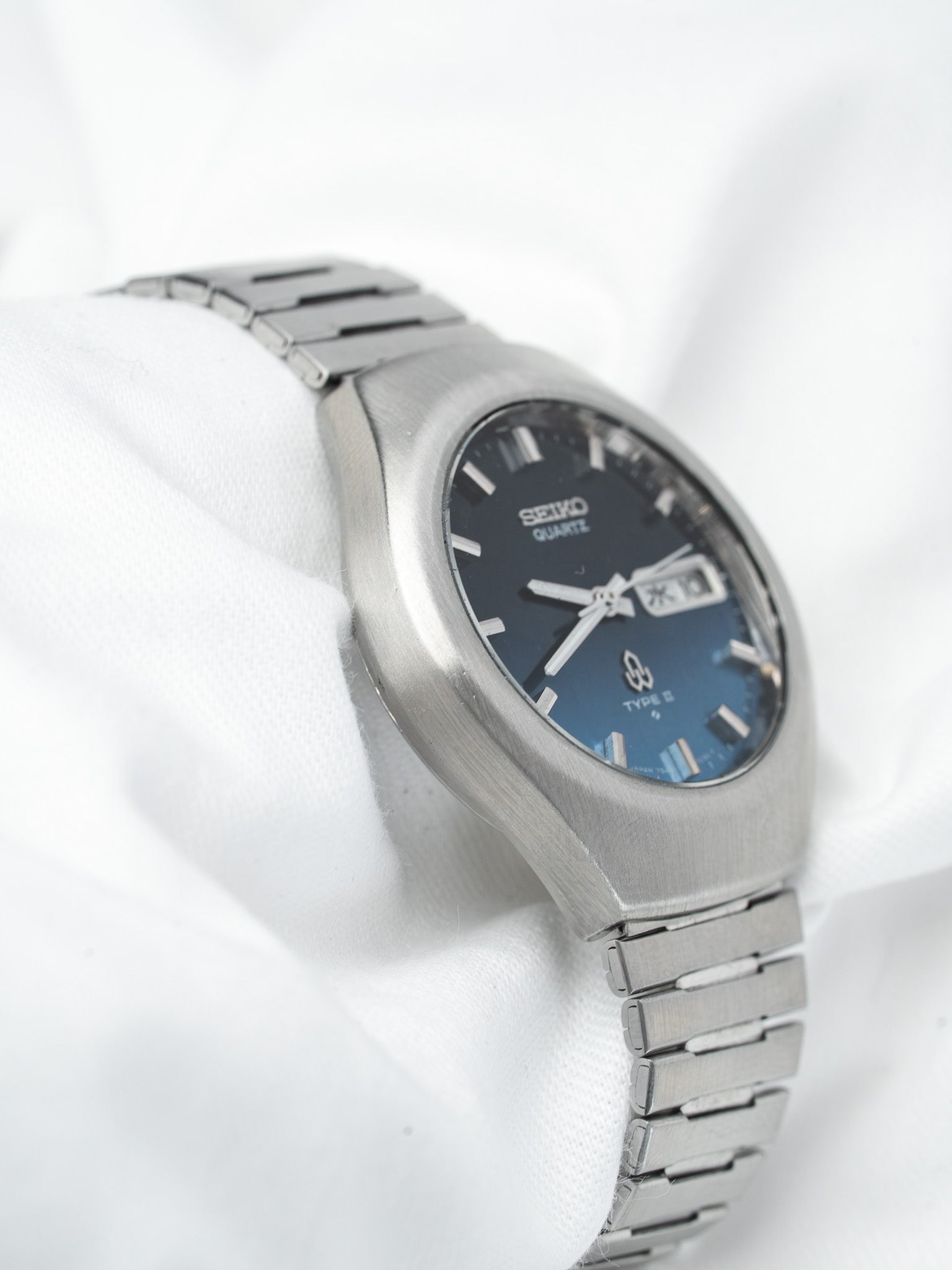 Seiko Type S vintage quartz watch with blue gradient dial and steel bracelet