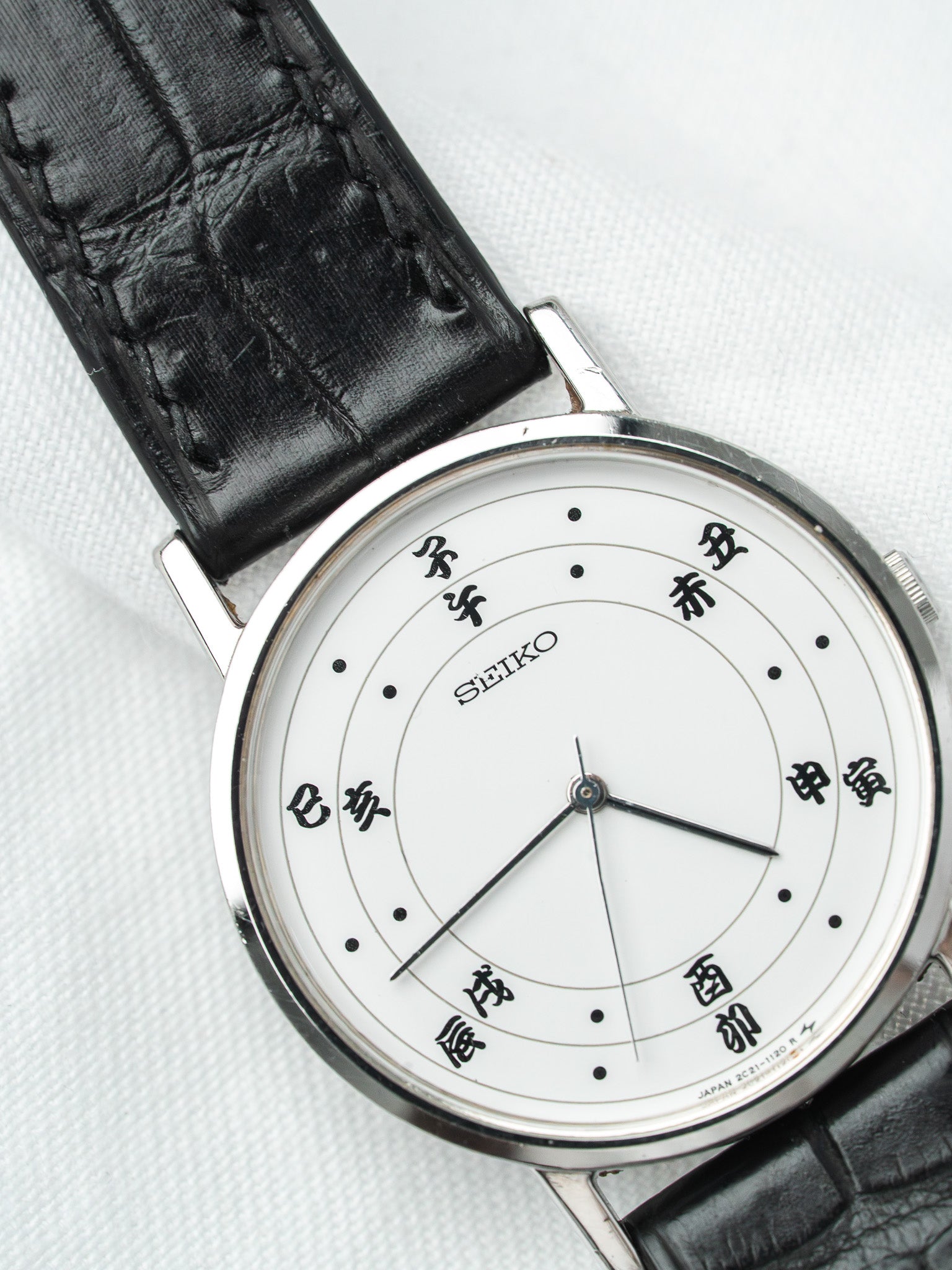 Seiko vintage watch with white dial, Japanese characters, black alligator strap