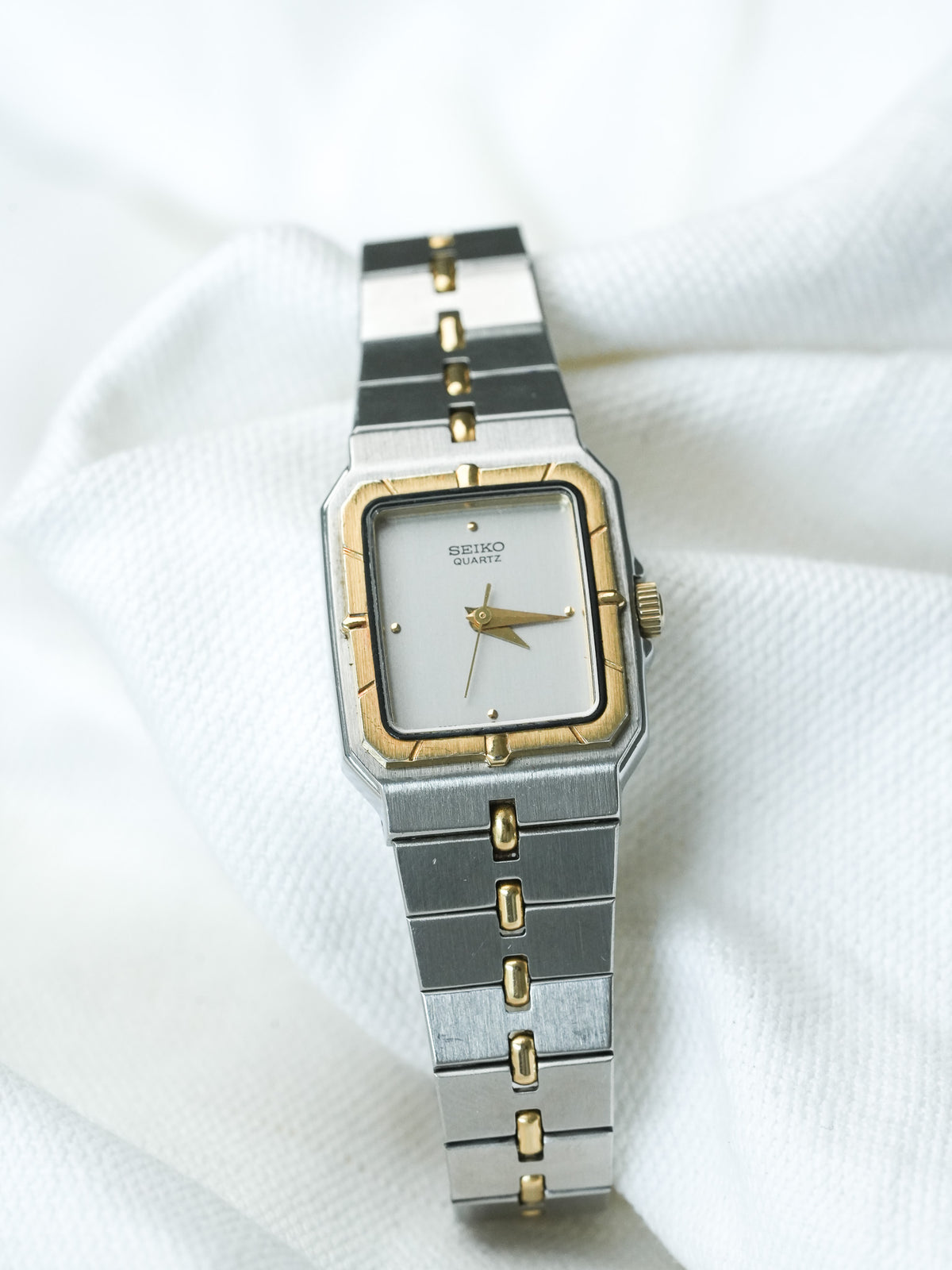 Seiko Quartz vintage watch with two-tone steel and gold bracelet, white dial