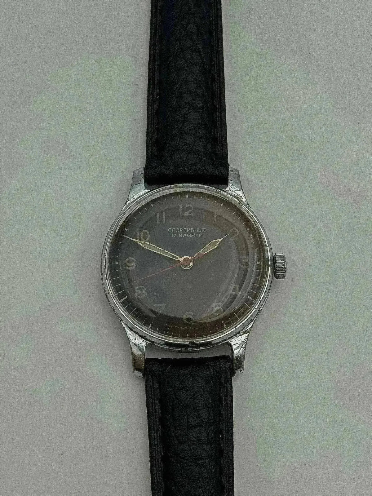 Vintage Soviet Sportivnye watch with gray dial, steel case, black leather strap