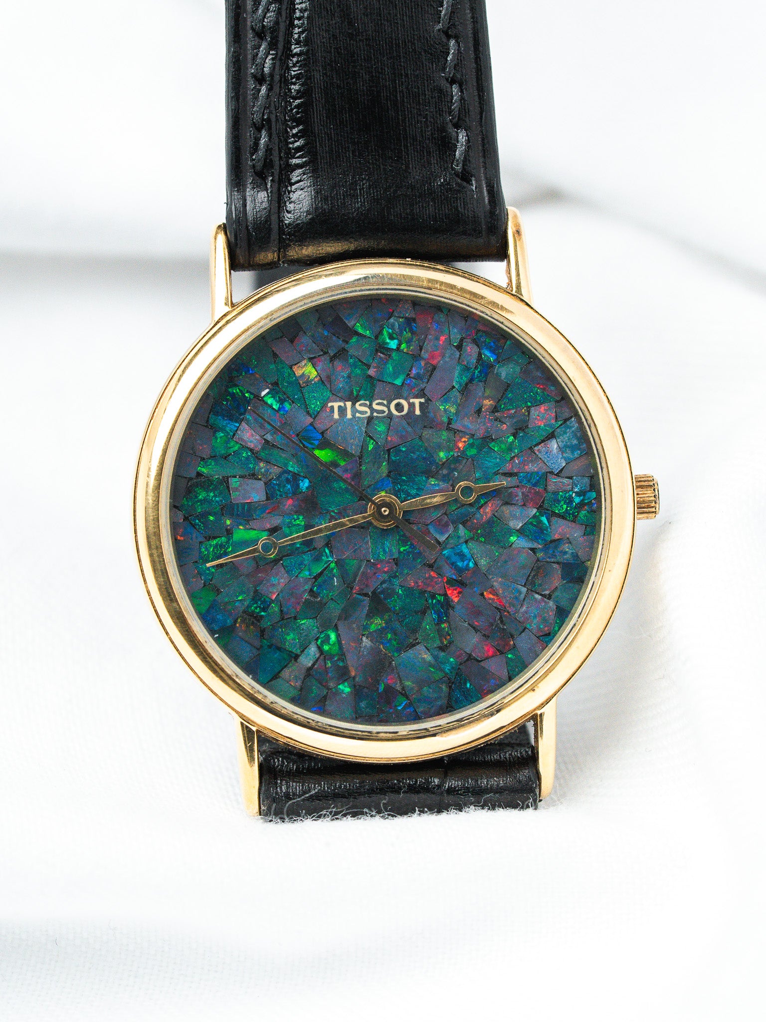 Tissot vintage watch with opal mosaic dial, gold case, black leather strap