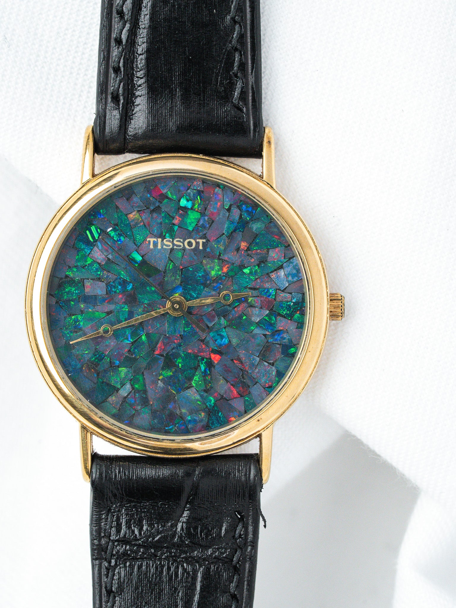 Tissot vintage watch with opal mosaic dial, gold case, black leather strap
