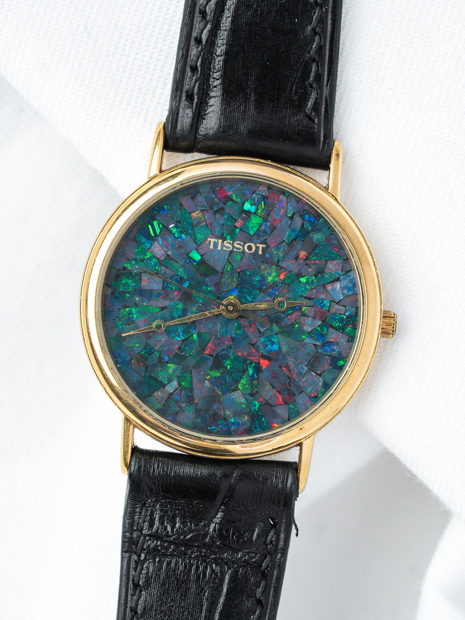 Tissot vintage watch with opal mosaic dial, gold case, black leather strap
