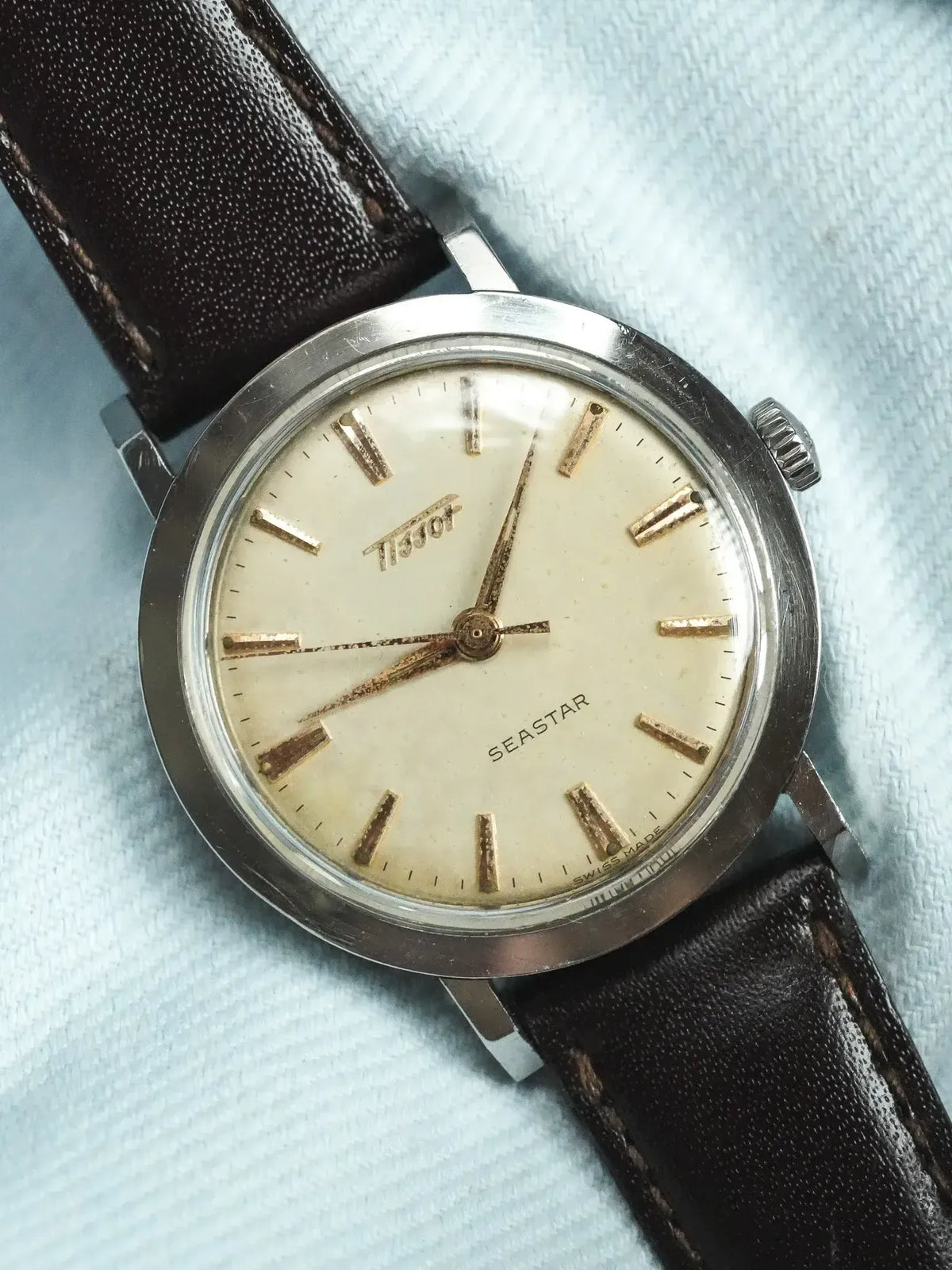 Tissot Seastar vintage watch with cream dial, gold markers, steel case, brown leather strap