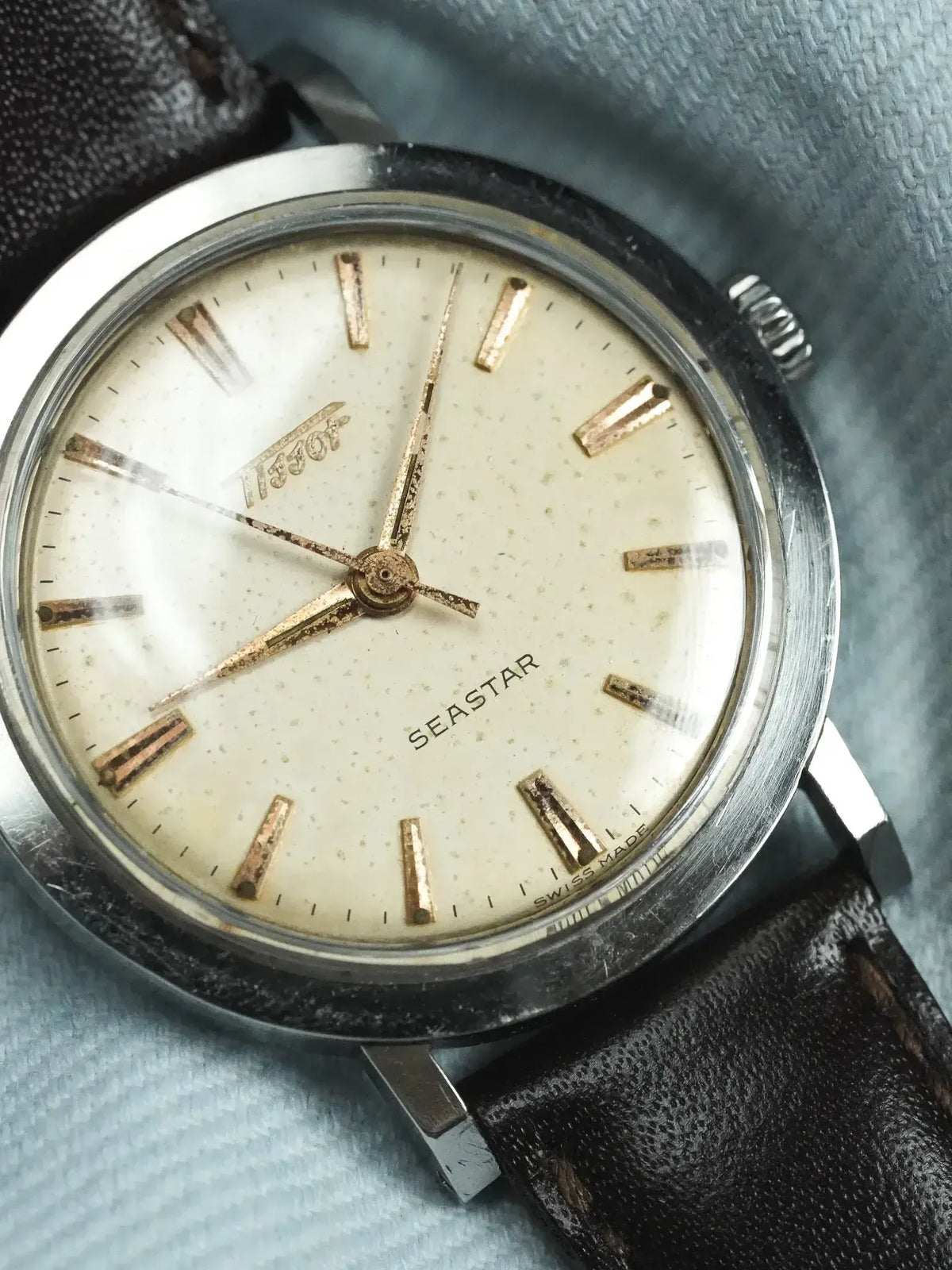 Tissot Seastar vintage watch with cream dial, gold markers, steel case, black leather strap
