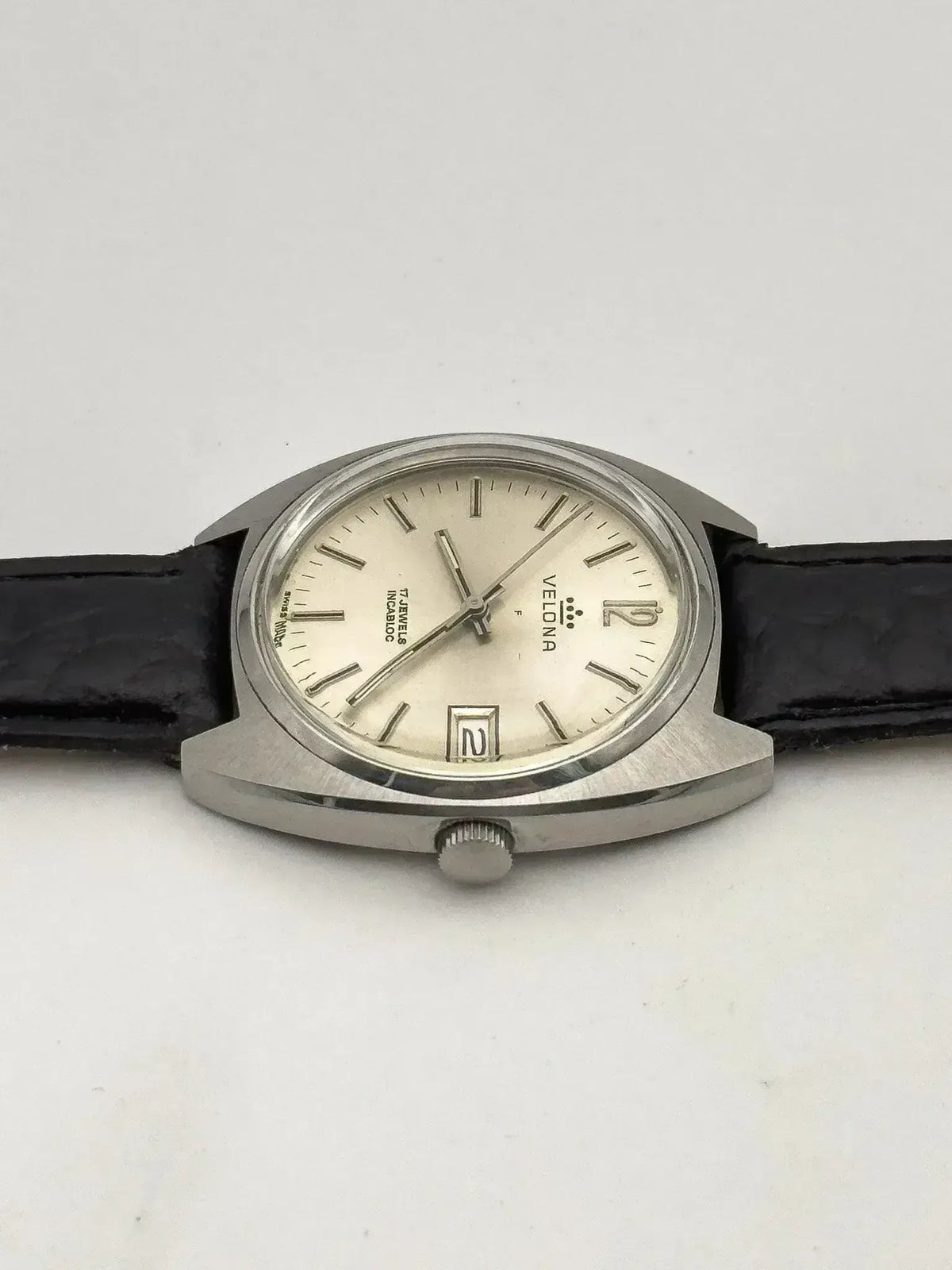 Velona vintage watch with silver case, cream dial, black leather strap