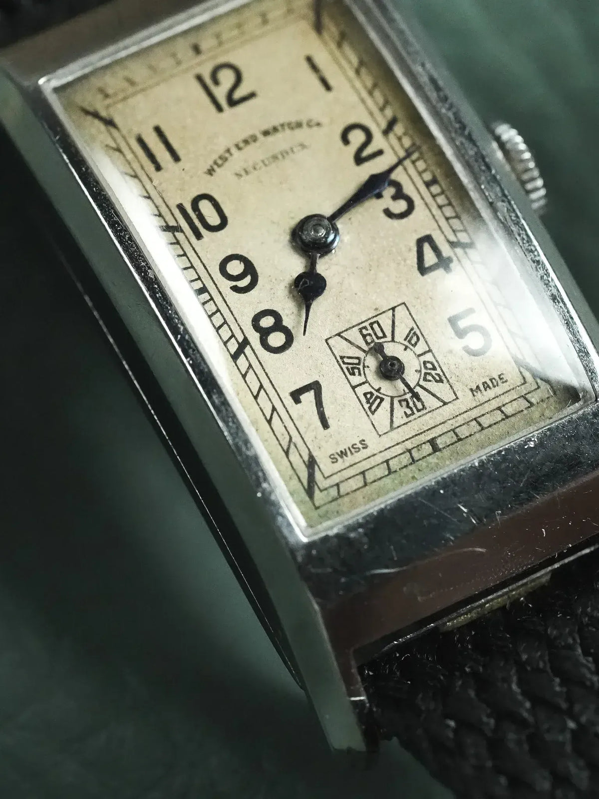 Vintage West End Watch Co. rectangular silver case, cream dial, black leather strap