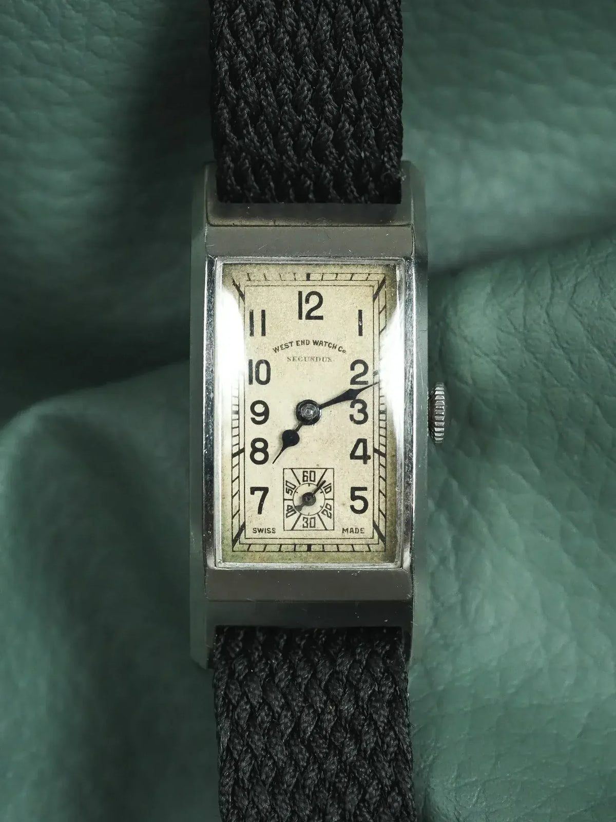 West End Watch Co. vintage rectangular watch with cream dial, black numerals, and braided strap
