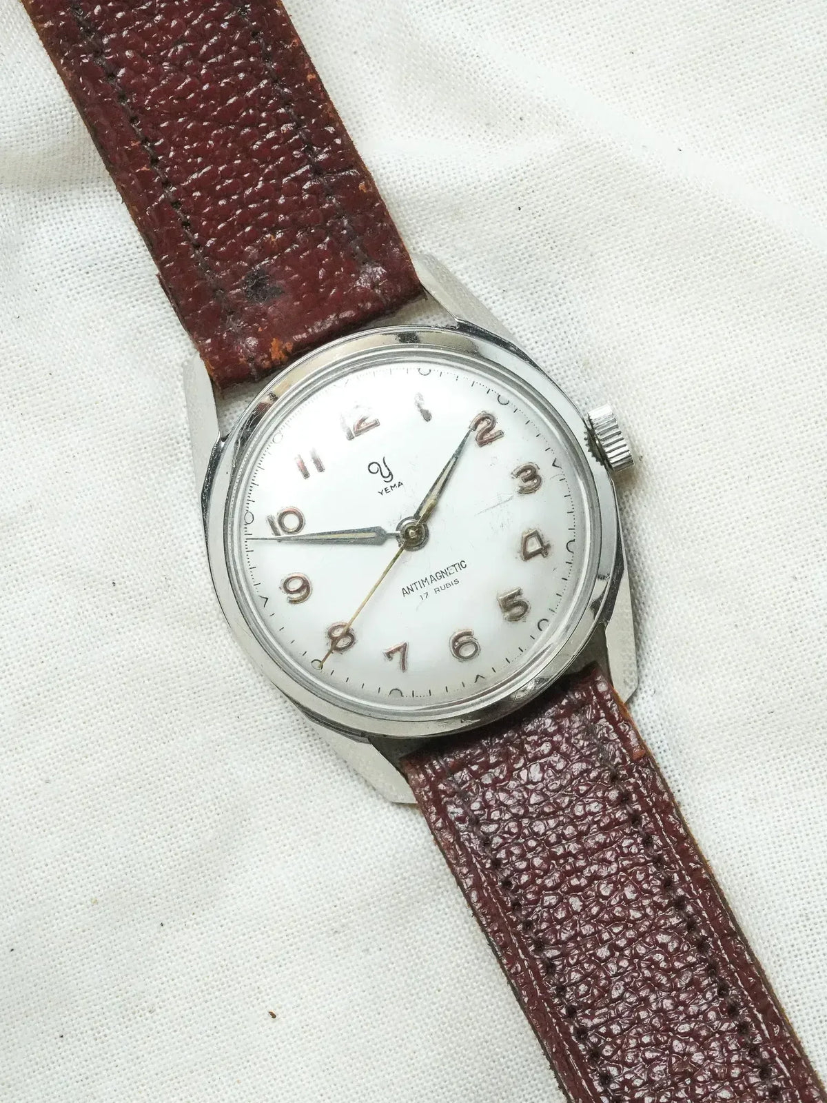 Vintage Yema watch with white dial, brown leather strap, antimagnetic 17 rubis