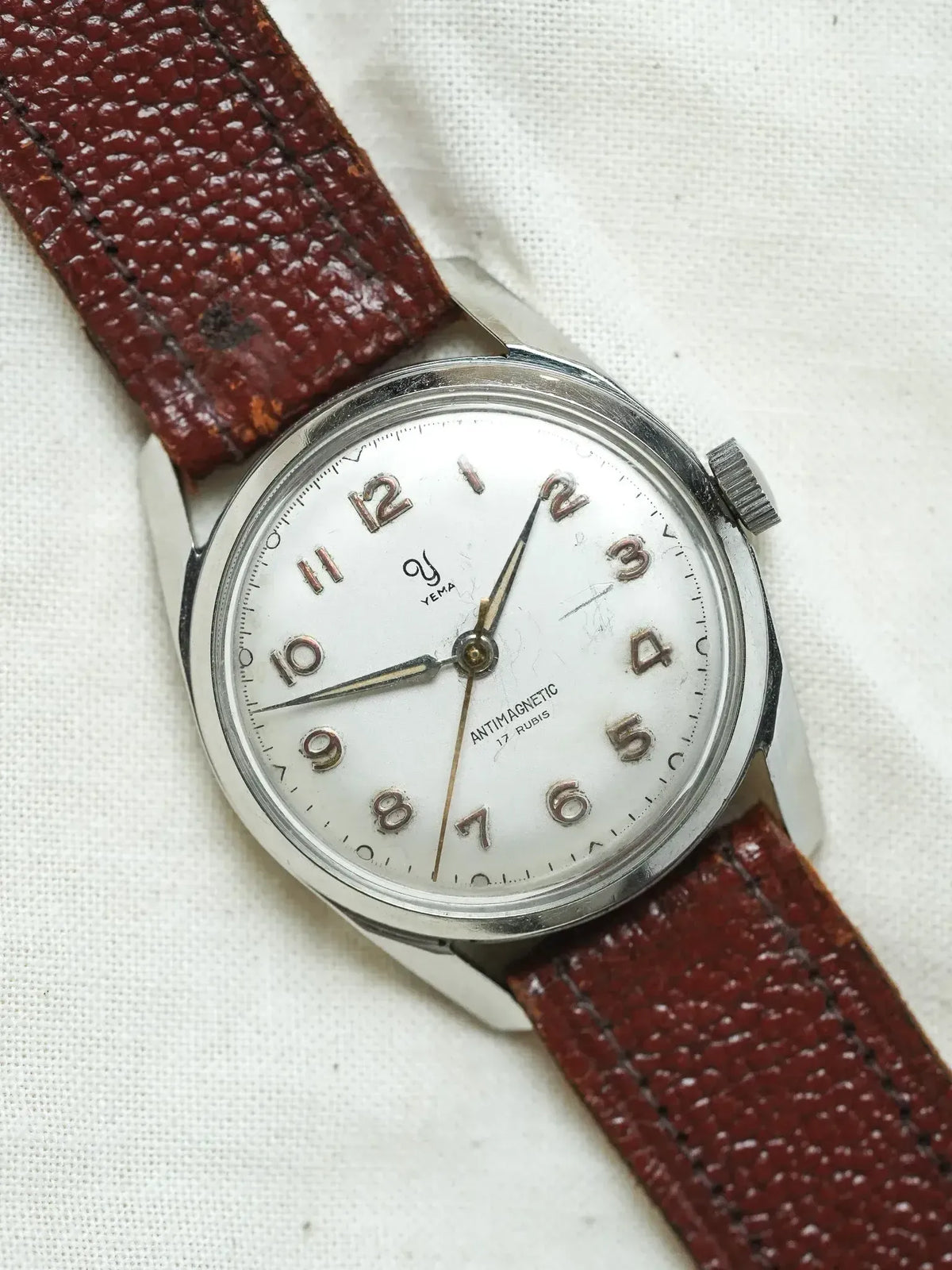 Vintage Yema watch with white dial, brown leather strap, antimagnetic 17 rubis