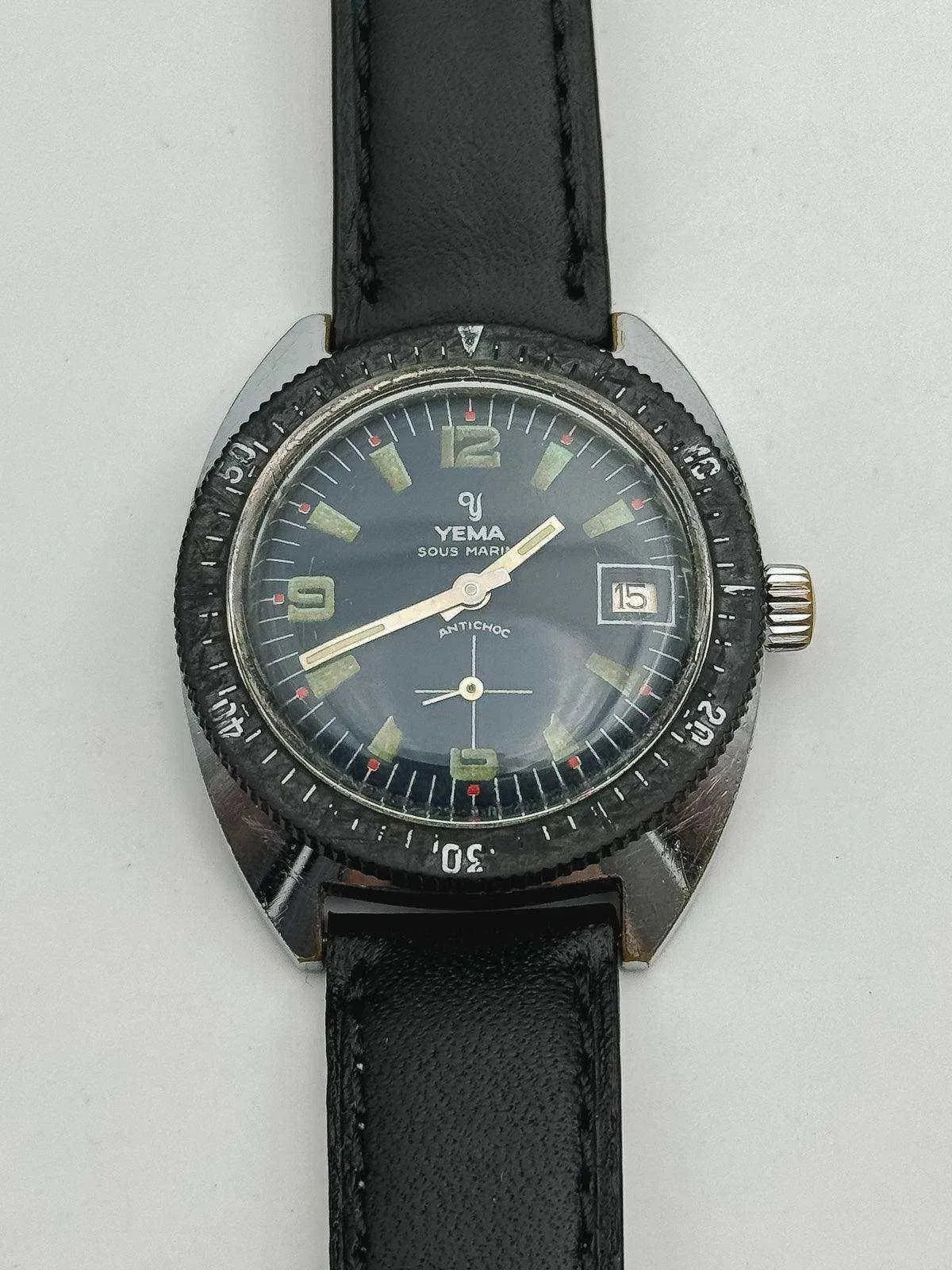 Yema Sous Marin vintage watch with black dial, luminous markers, and leather strap
