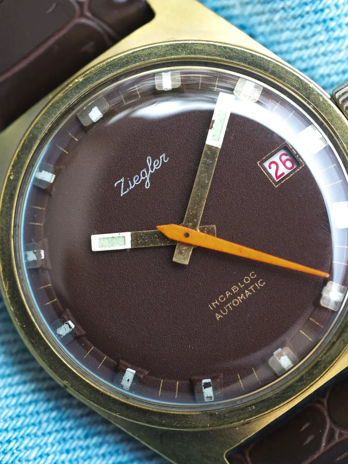 Ziegler vintage automatic watch with brown dial, orange seconds hand, and date window