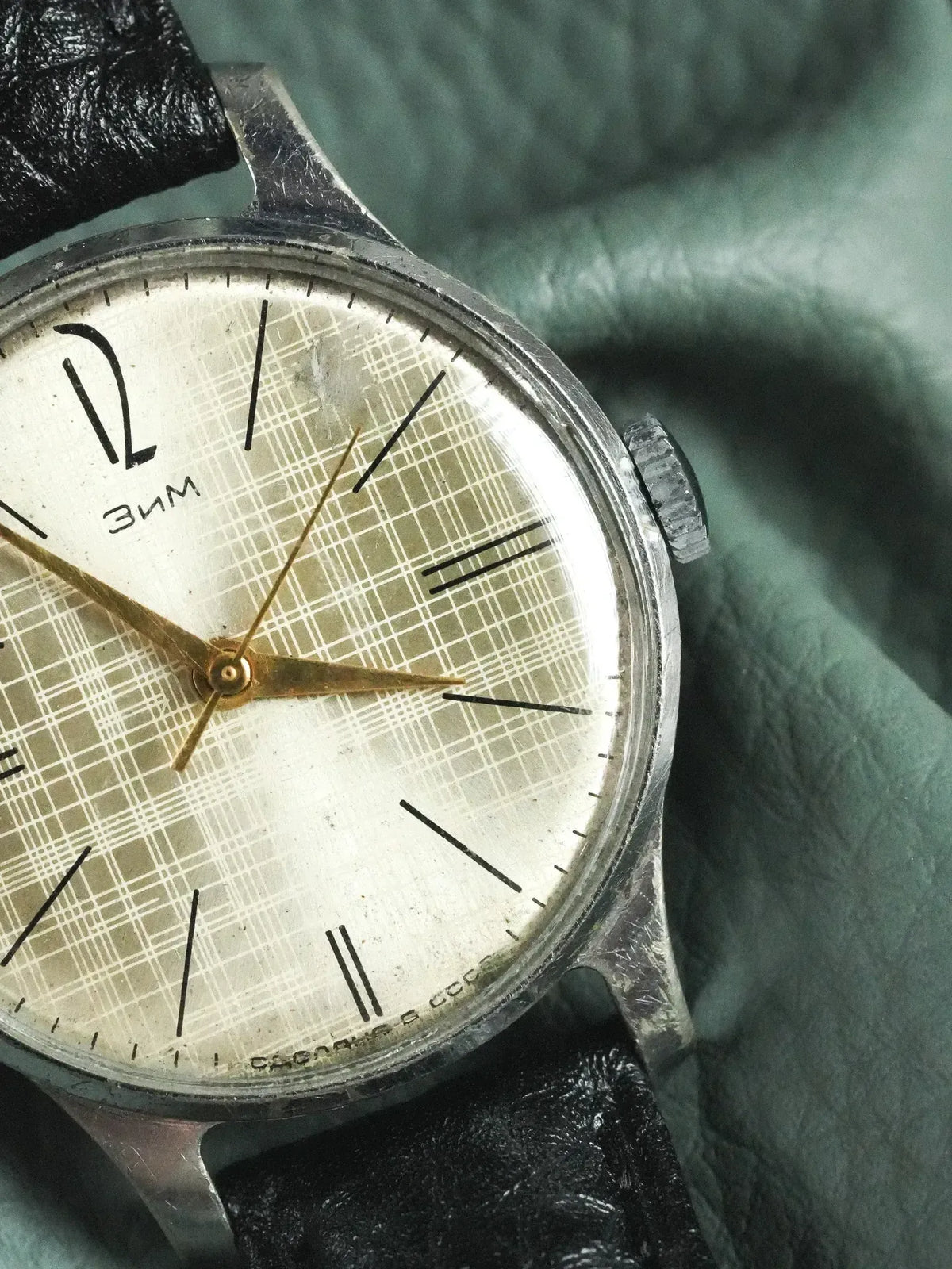 Vintage Zim watch with grid dial, gold hands, black leather strap