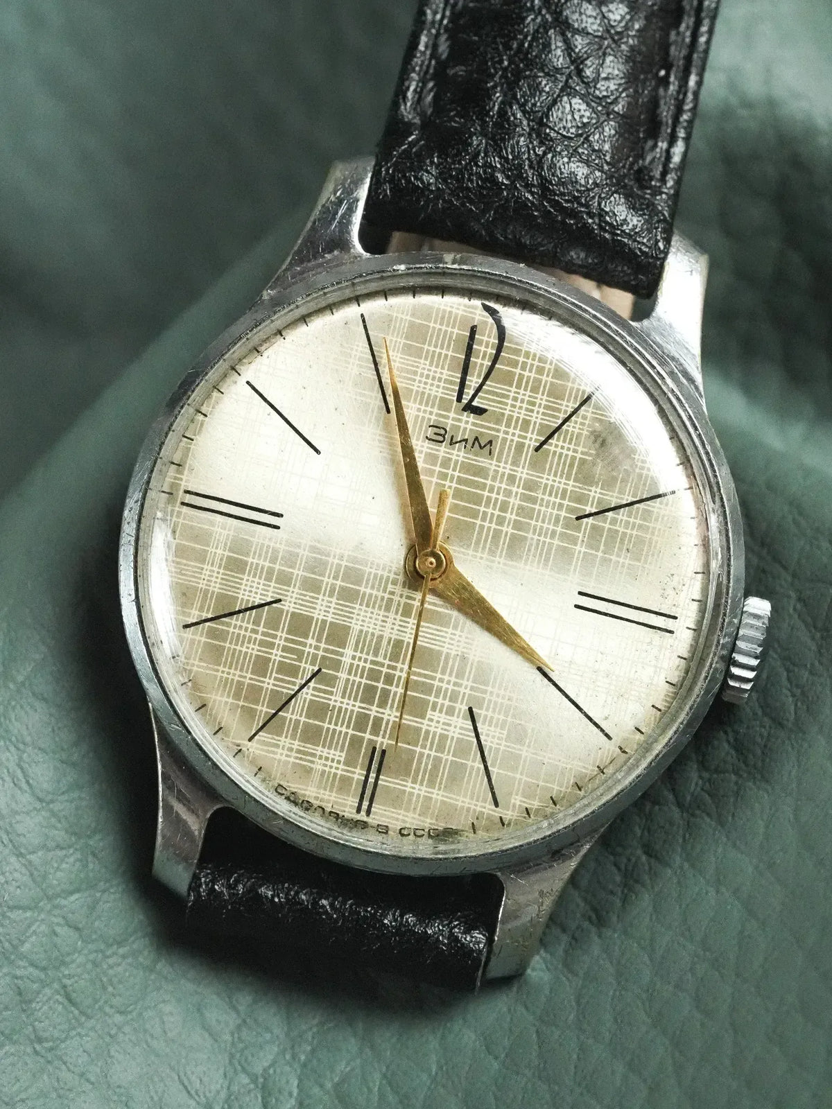 Vintage Zim watch with silver case, cream dial, black leather strap