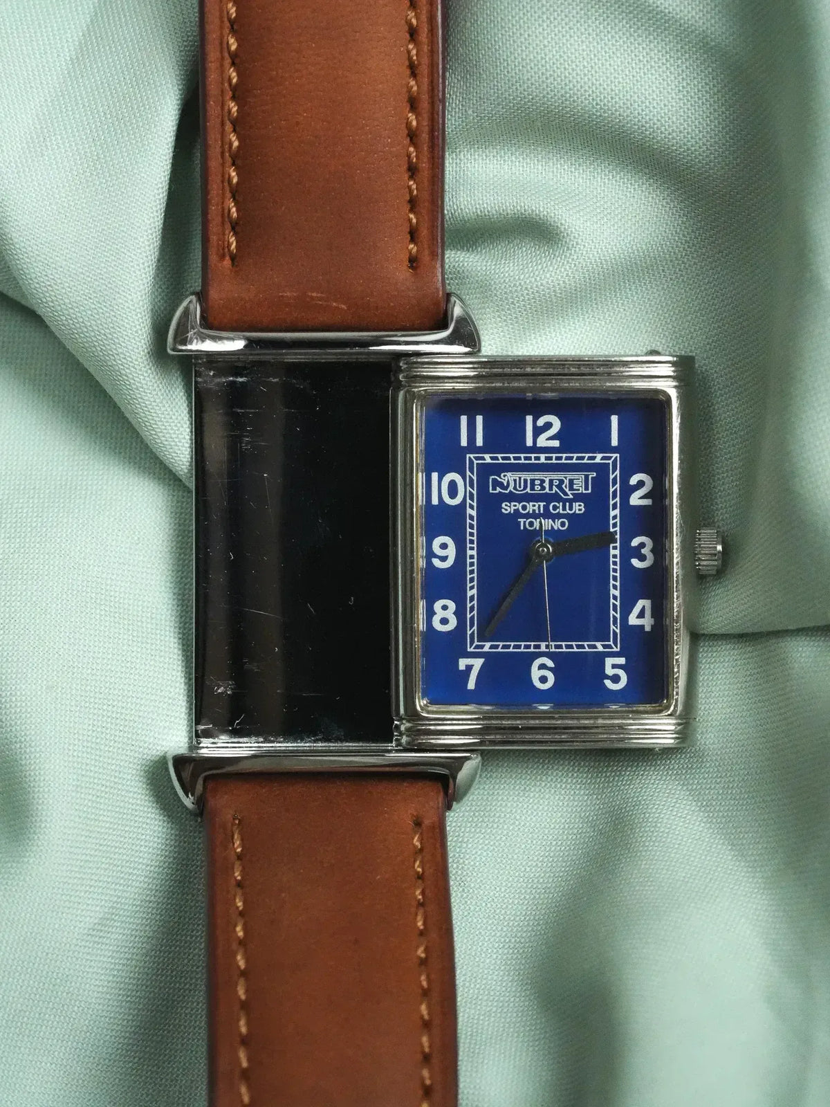 Nubret Sport Club Torino vintage watch with blue dial, silver case, brown leather strap