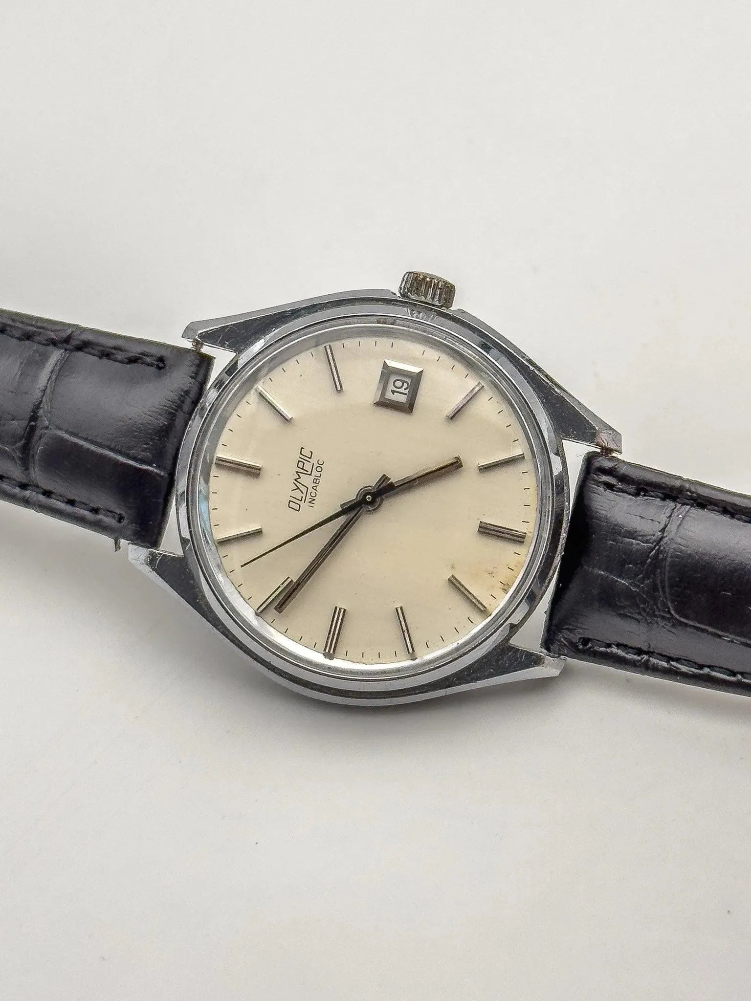 Olympic - Incabloc Date Cream - 1970s - Atelier Victor Paris - Vintage Watch Shop Dubai