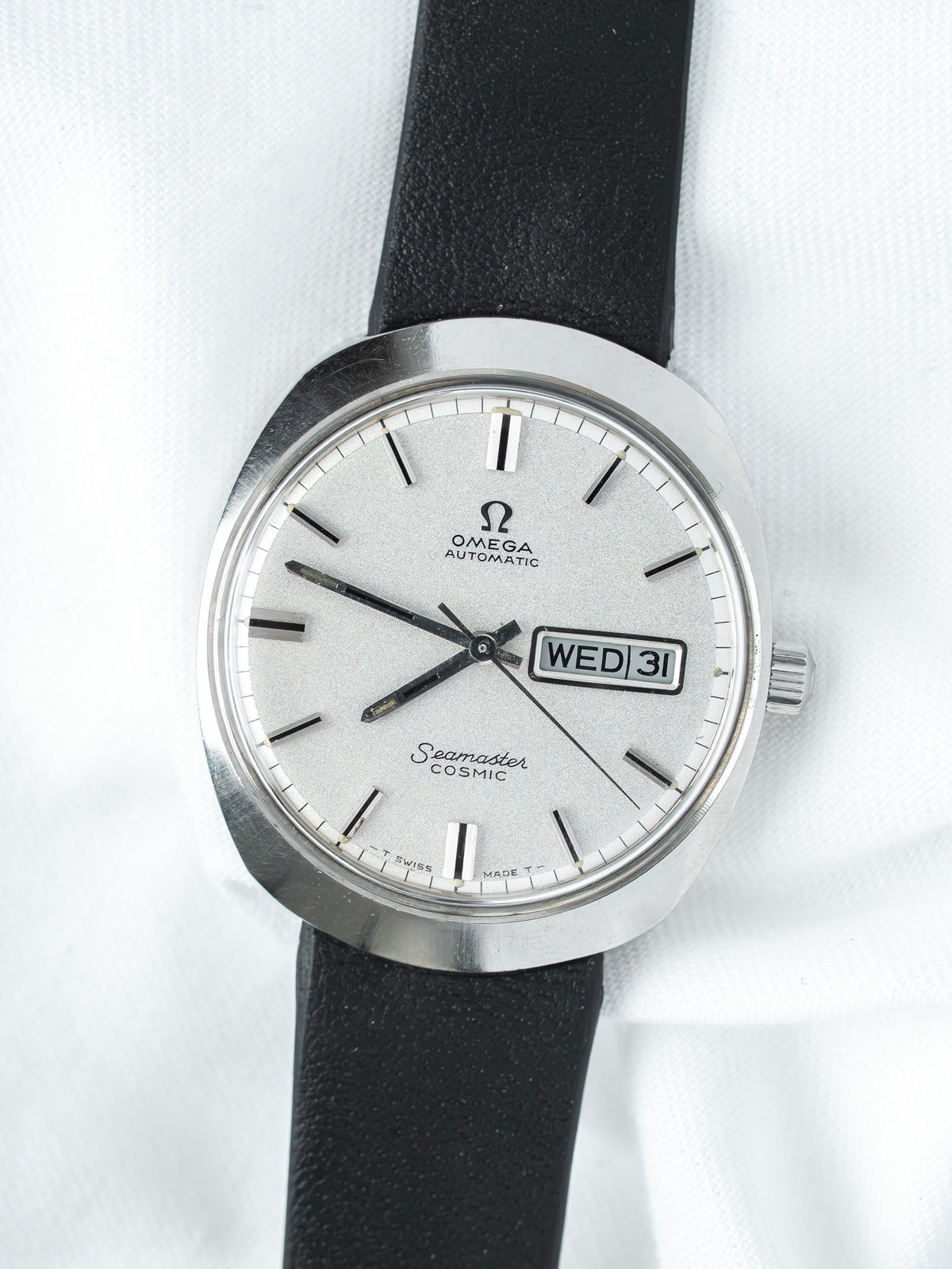 Omega Seamaster Cosmic vintage watch with silver dial and black leather strap