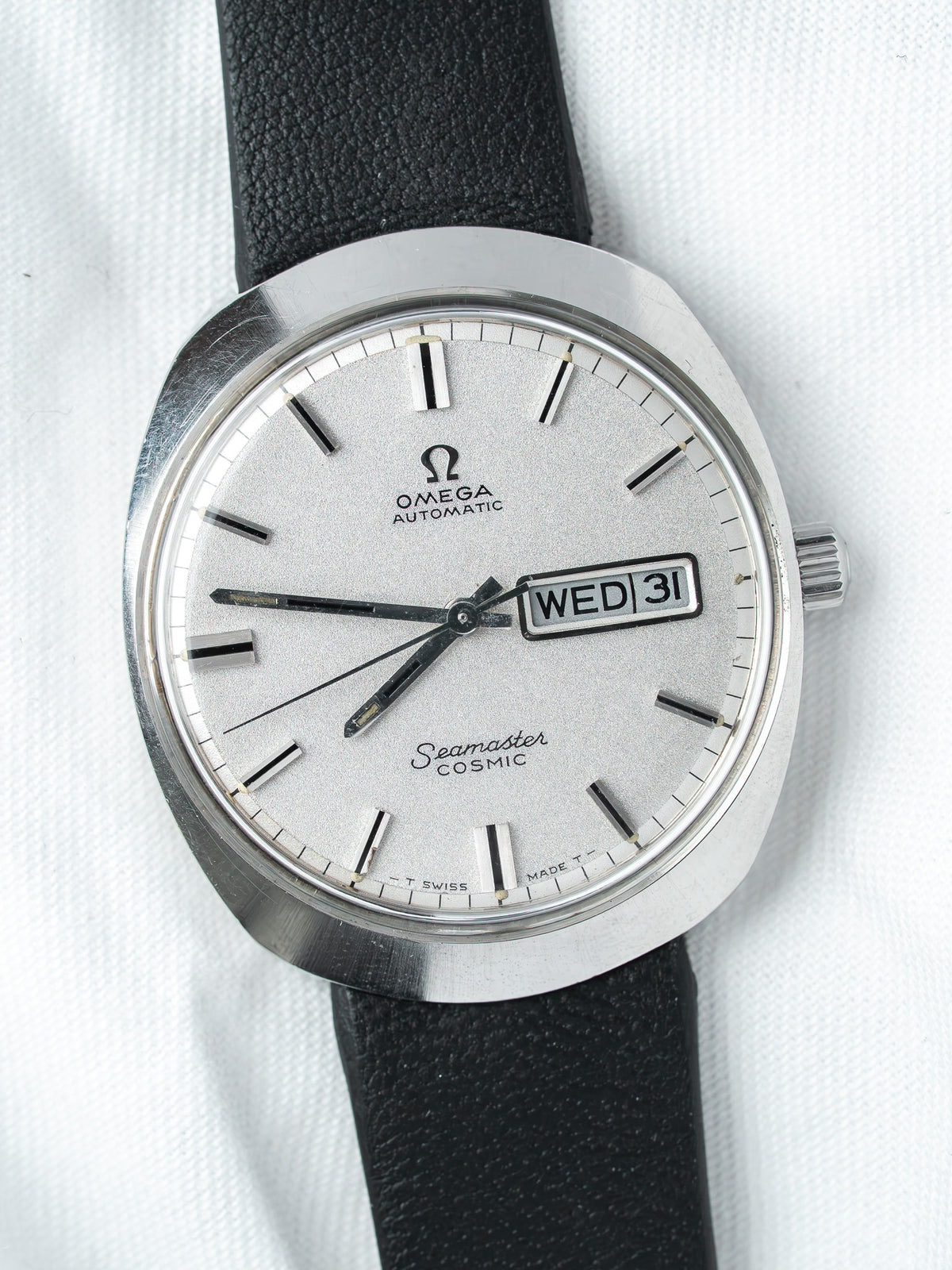 Omega Seamaster Cosmic vintage watch with silver dial and black leather strap