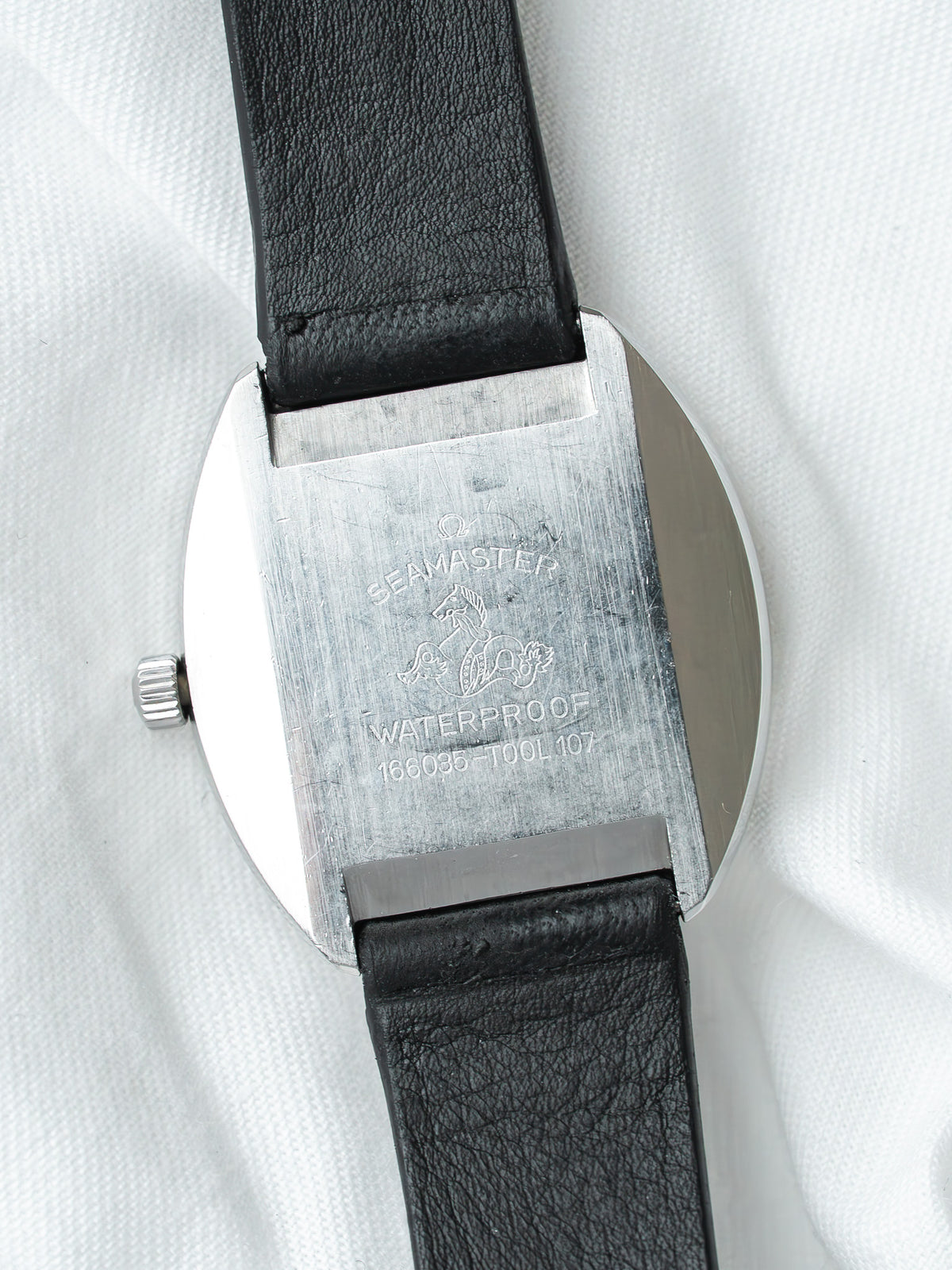 Omega Seamaster vintage watch with engraved case back and black leather strap