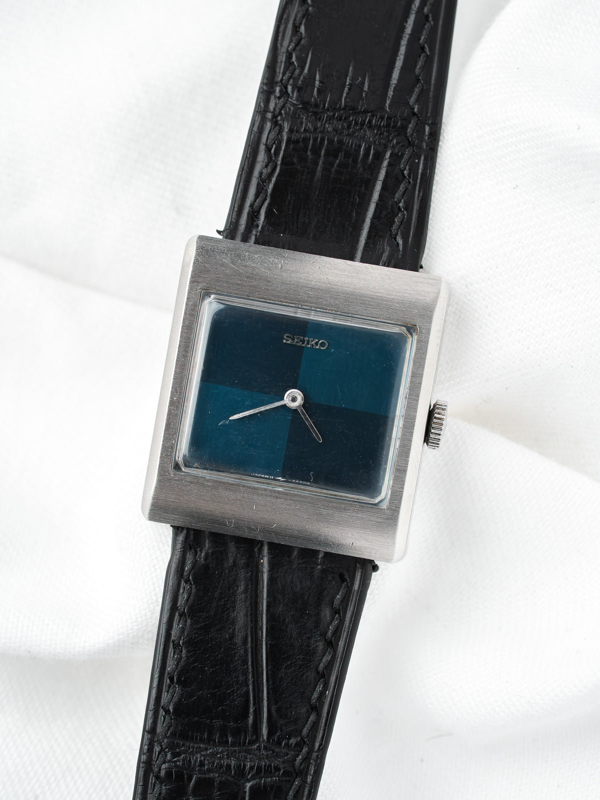 Seiko vintage watch with square case, blue dial, black leather strap