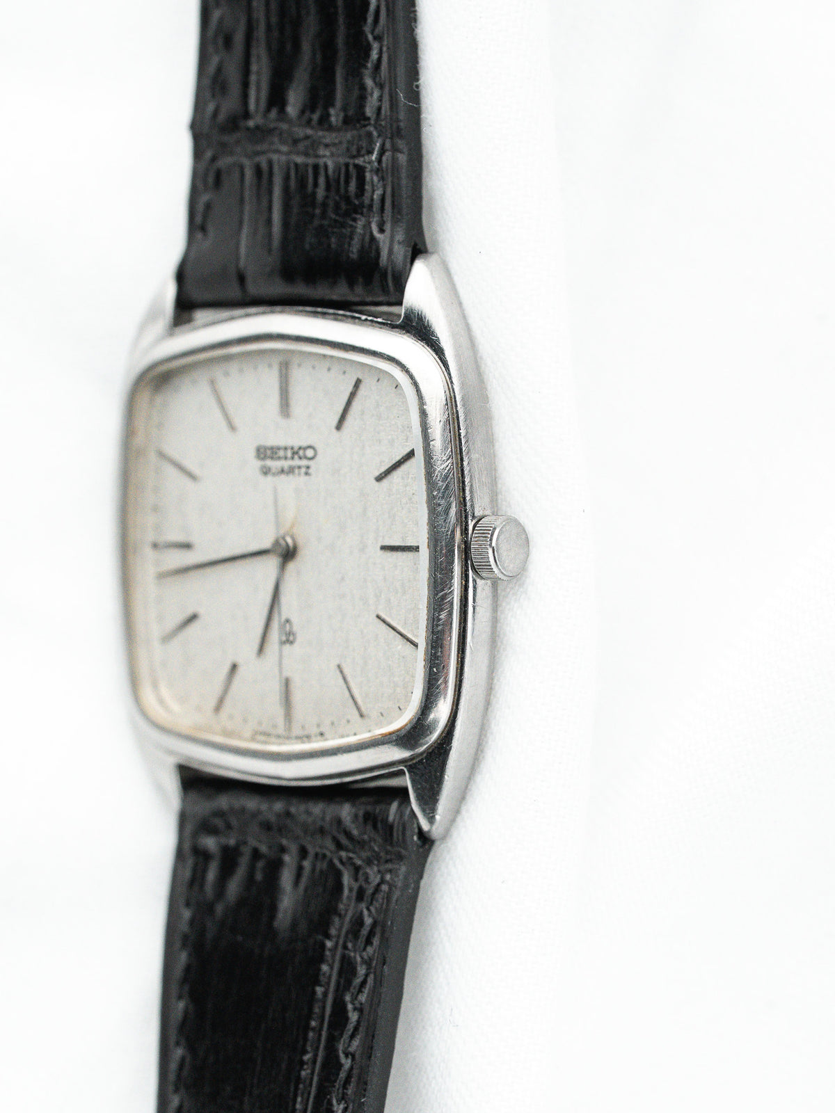 Seiko Quartz vintage watch with silver dial and black leather strap