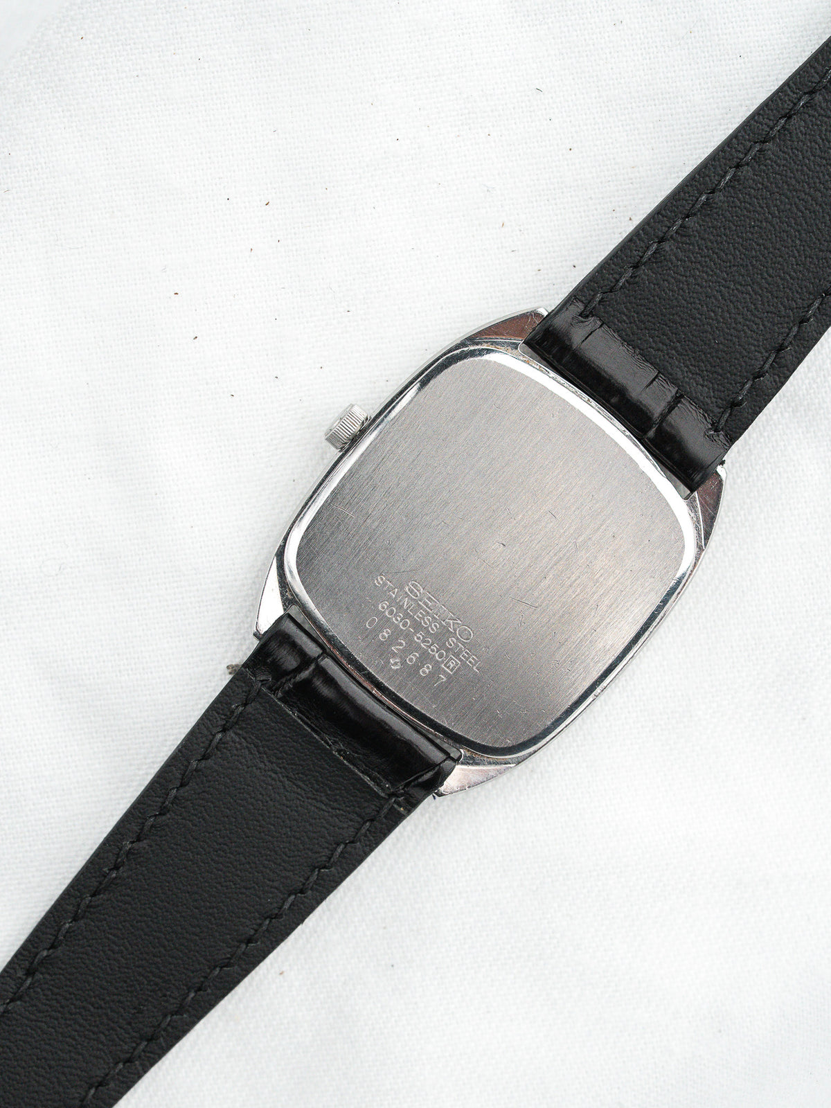 Seiko vintage watch with stainless steel case and black leather strap