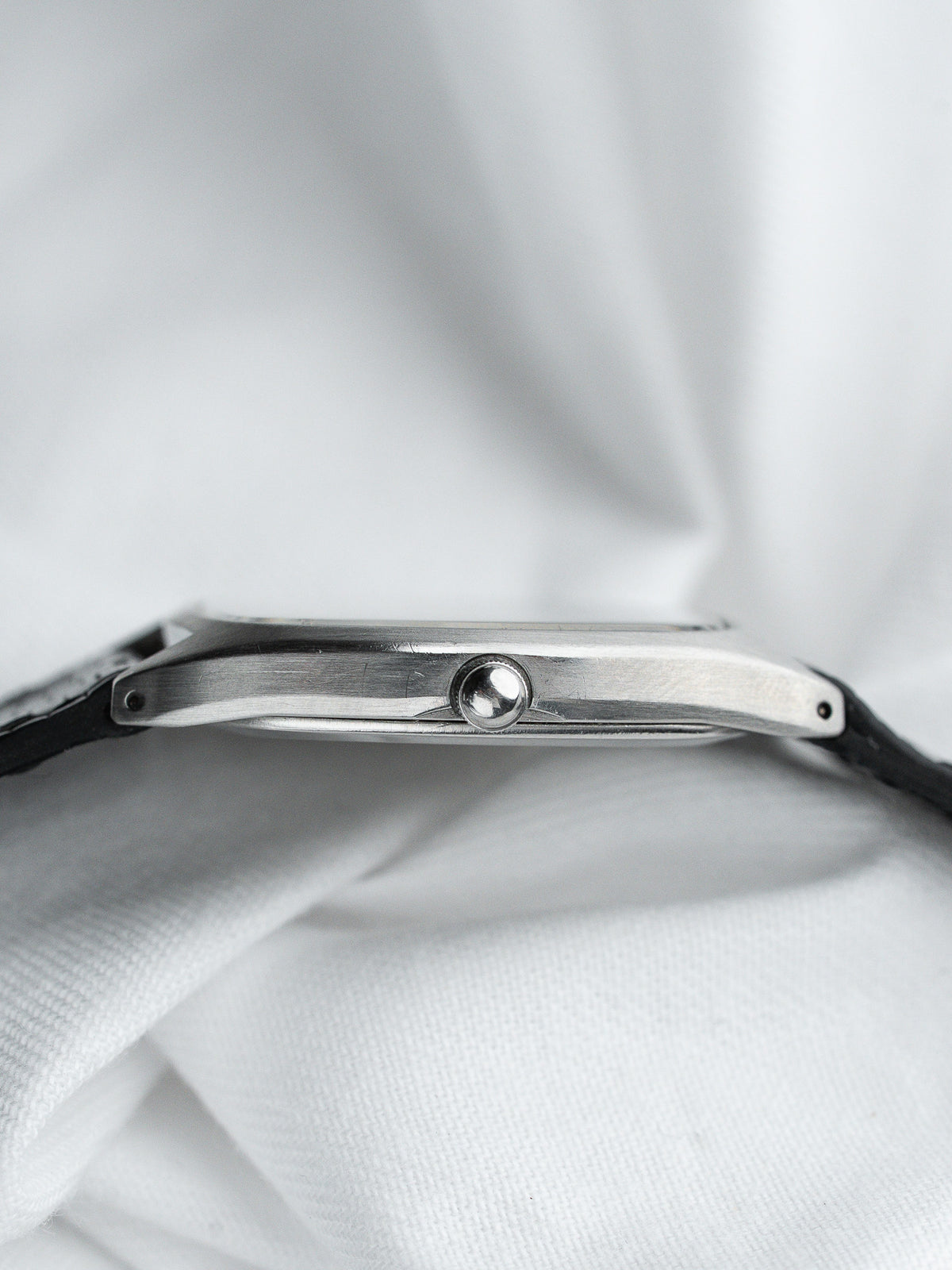 Vintage Cartier watch with steel case and black leather strap