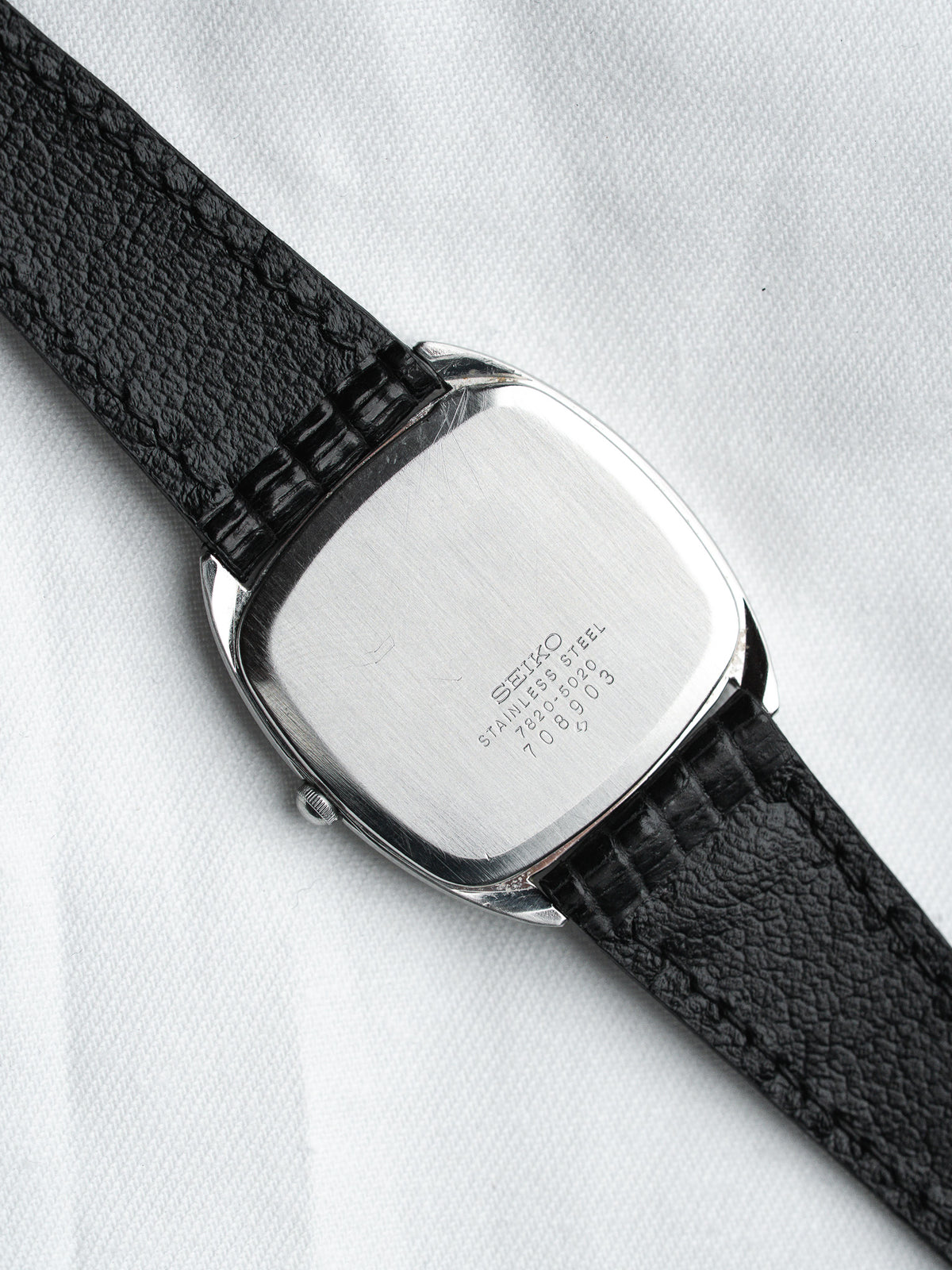 Seiko vintage watch with stainless steel case and black textured strap