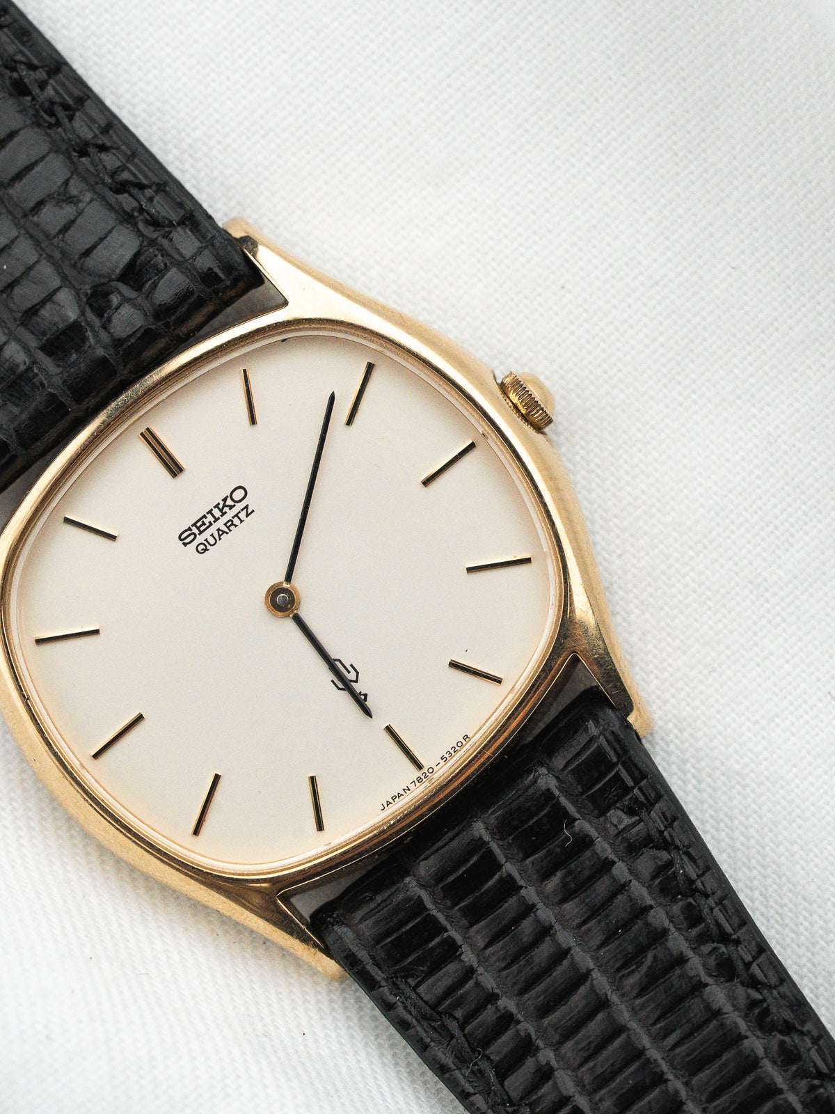Seiko Quartz vintage watch with gold case, white dial, black alligator strap