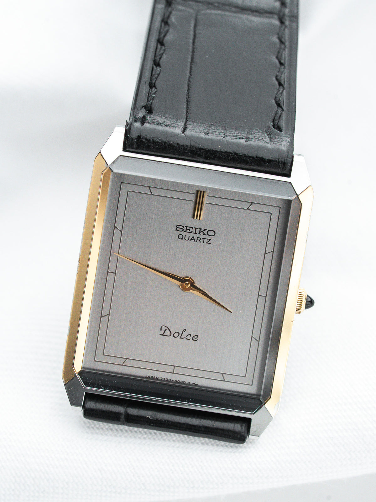 Seiko Dolce vintage quartz watch with gold accents and black leather strap