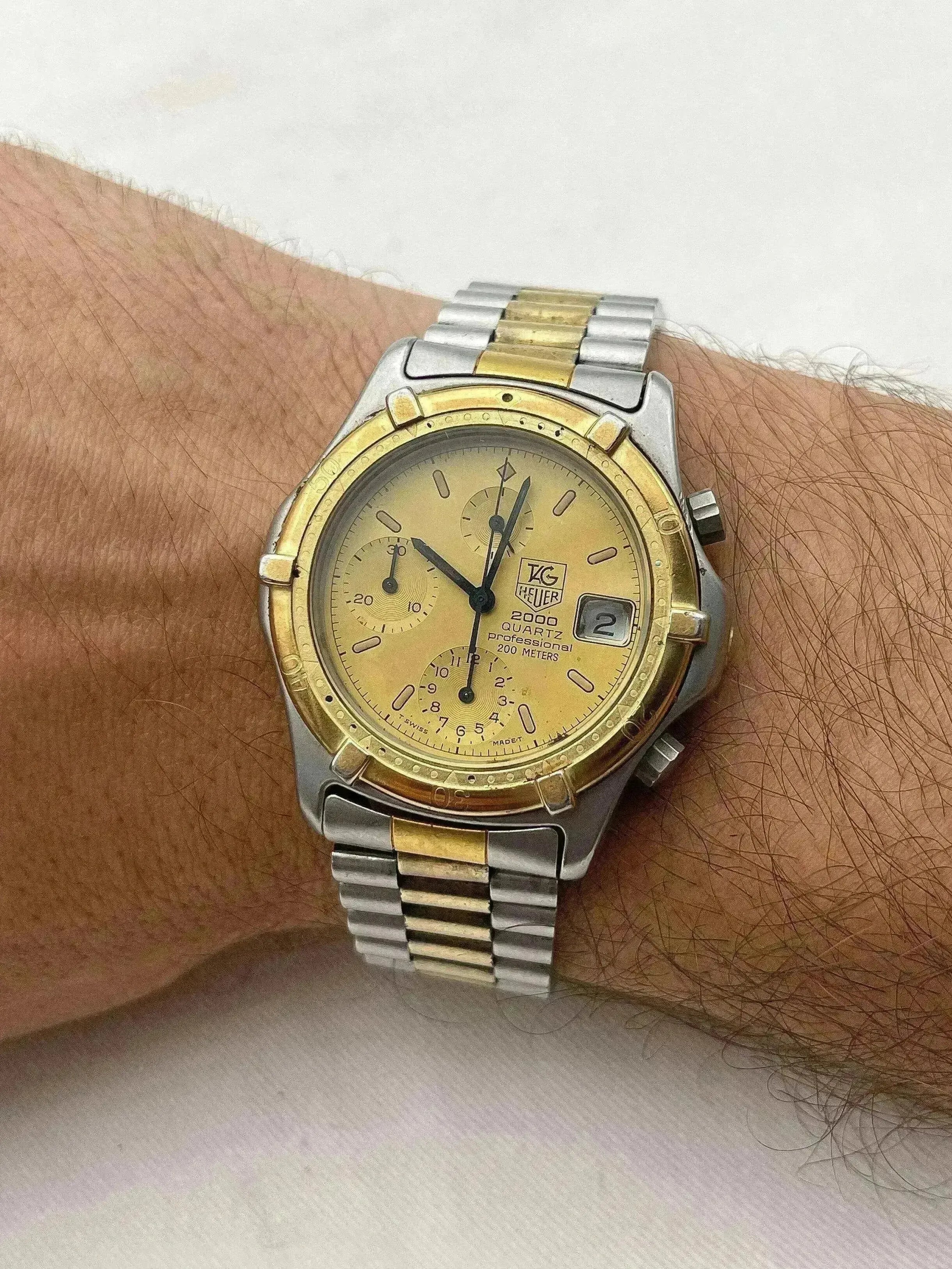 TAG Heuer 2000 Quartz vintage chronograph, two-tone steel and gold, gold dial, worn on wrist