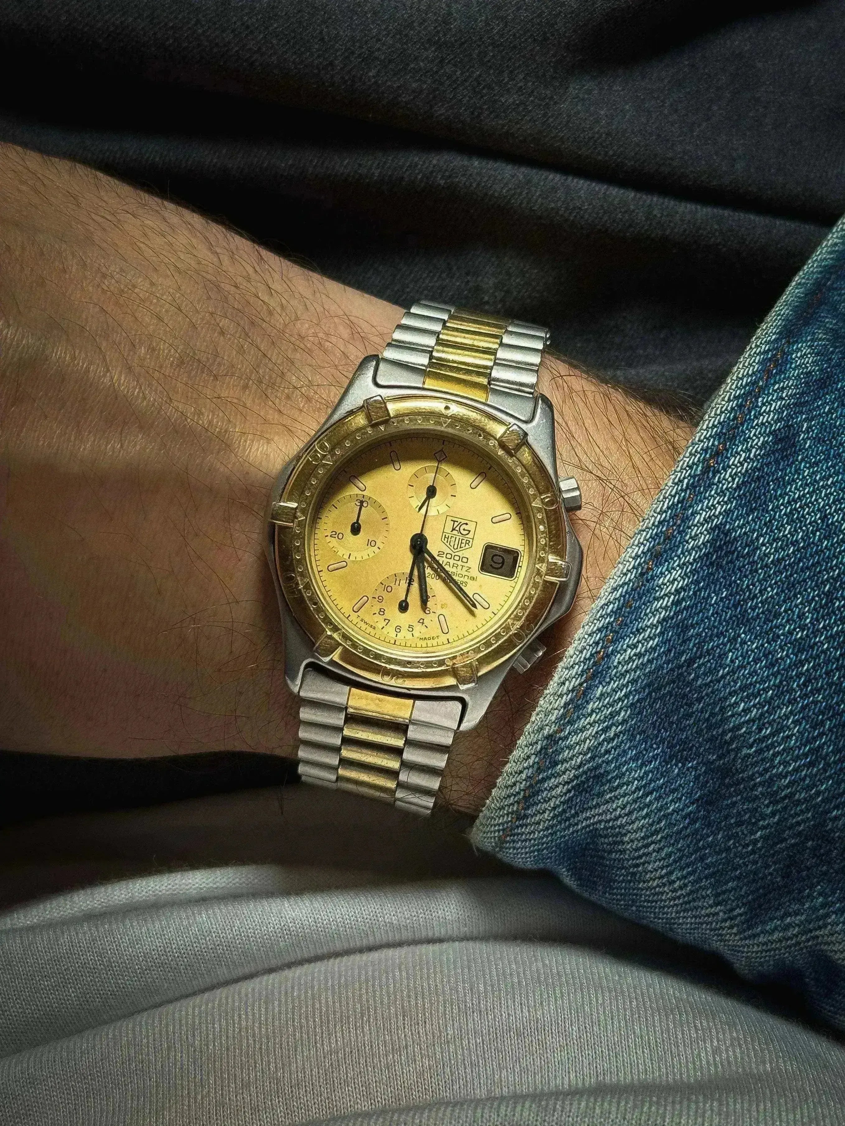 TAG Heuer 2000 Quartz vintage watch with gold dial, two-tone bracelet, worn on wrist
