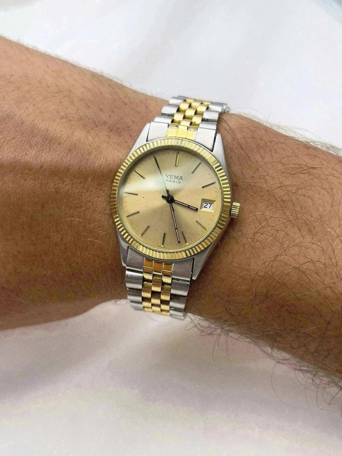 YEMA Paris vintage watch with gold dial, two-tone bracelet, worn on wrist